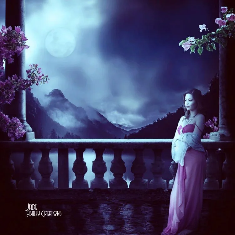 A woman in a pink gown standing on a balcony with a mountainous landscape and full moon in the background, surrounded by flowers.