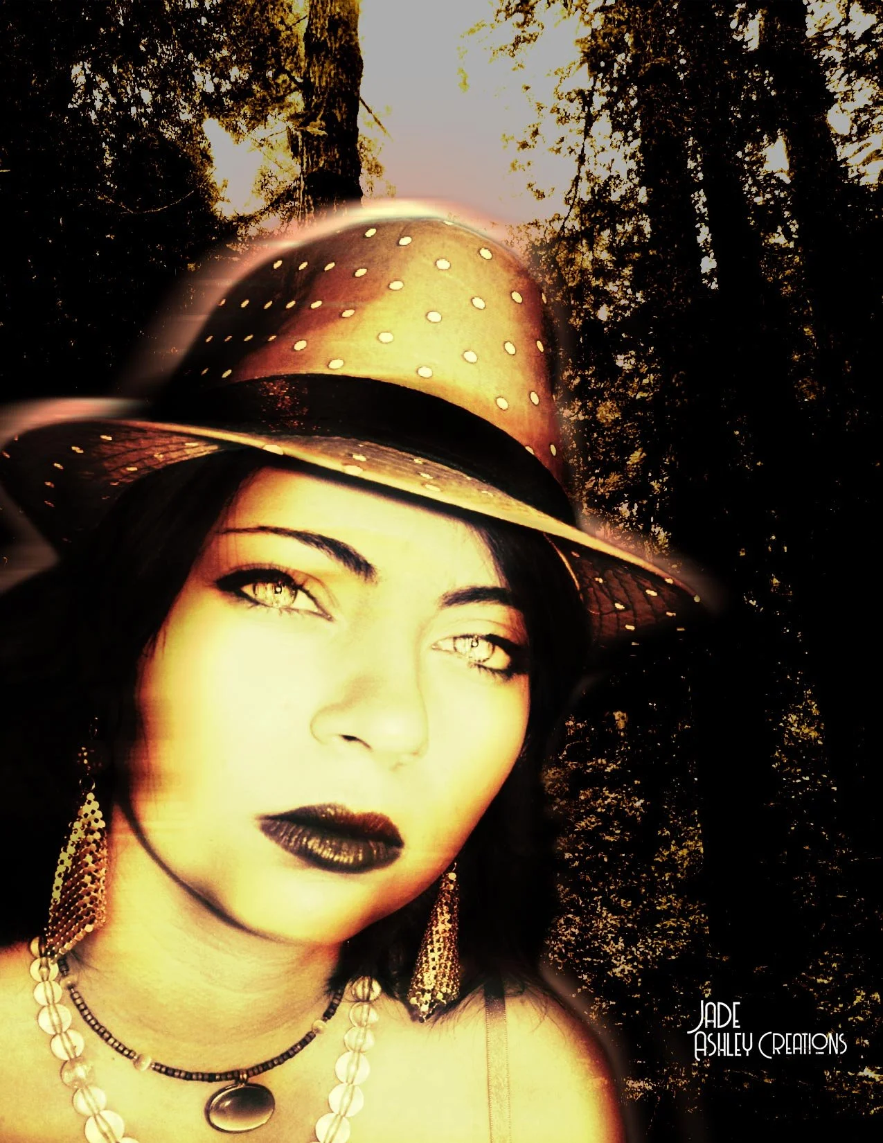 A woman with dark hair and makeup, wearing a polka-dotted wide-brimmed hat, gold earrings, and necklaces, standing in a forest at sunset.
