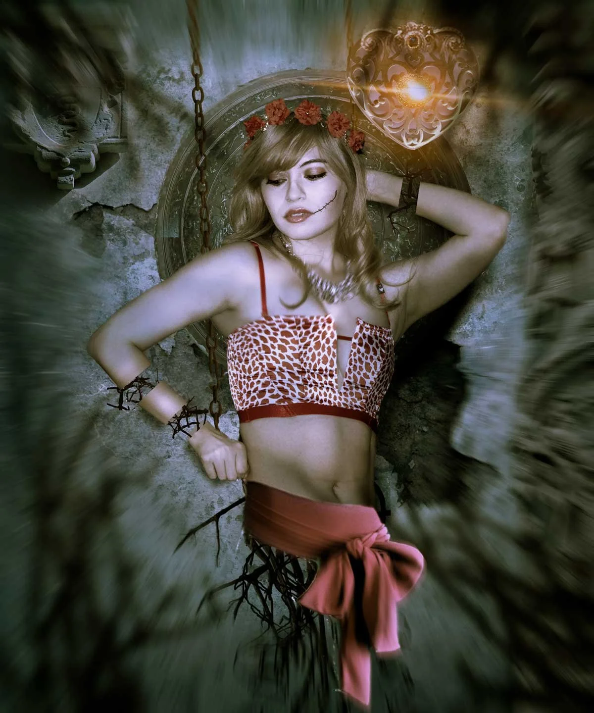 Woman lying on a stone surface, wearing a red animal print crop top, red skirt tied at the waist, with chain and bracelet accessories, floral headband, and face makeup resembling a skeleton or skull. There is a glowing heart-shaped light fixture abov