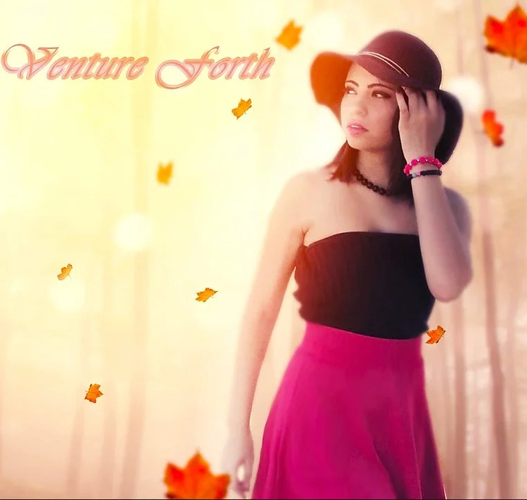 A young woman wearing a black strapless top, pink skirt, and a black hat, standing in front of a blurred fall backdrop with falling leaves and the text 'Venture Forth' in pink cursive.