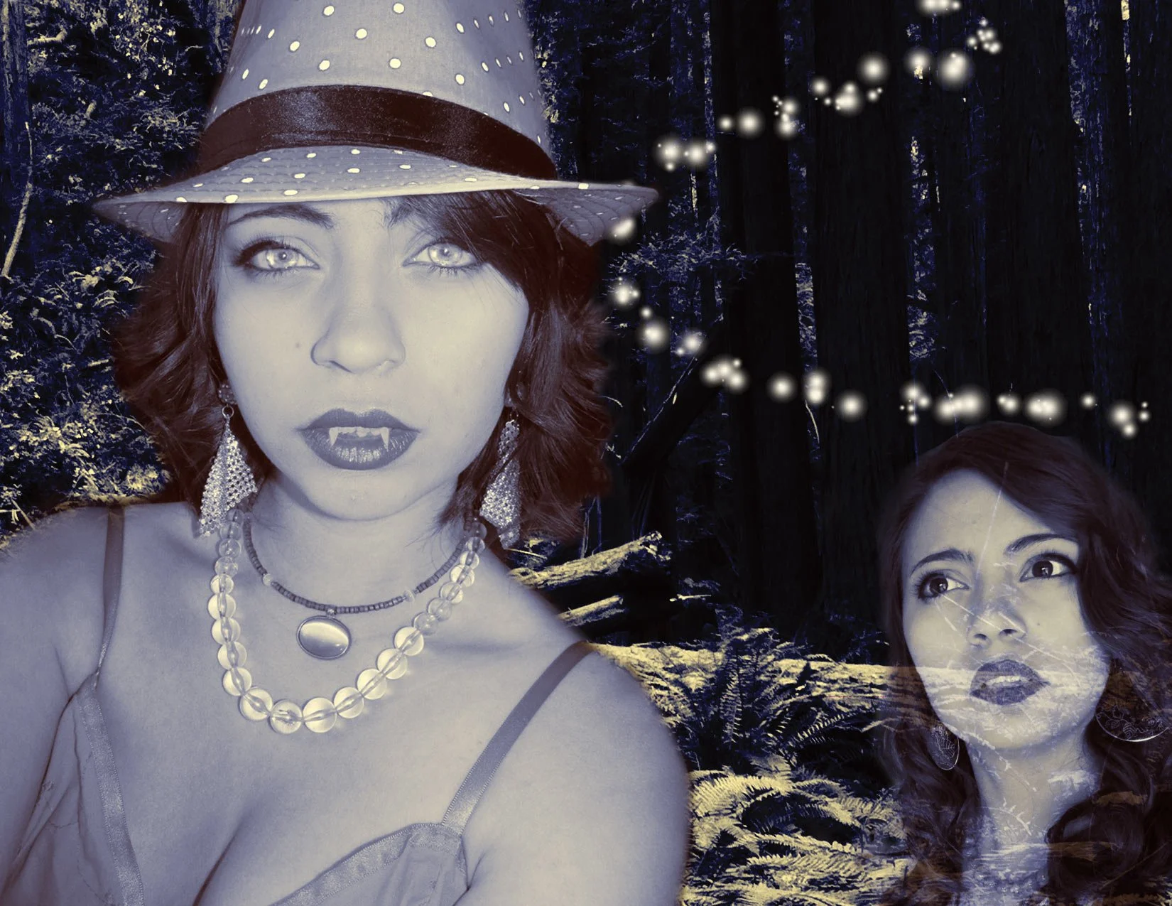 Double exposure photo of two women with dark hair and makeup in a forest at night, with string lights in the background. The woman in the foreground wears a hat, earrings, and layered necklaces.