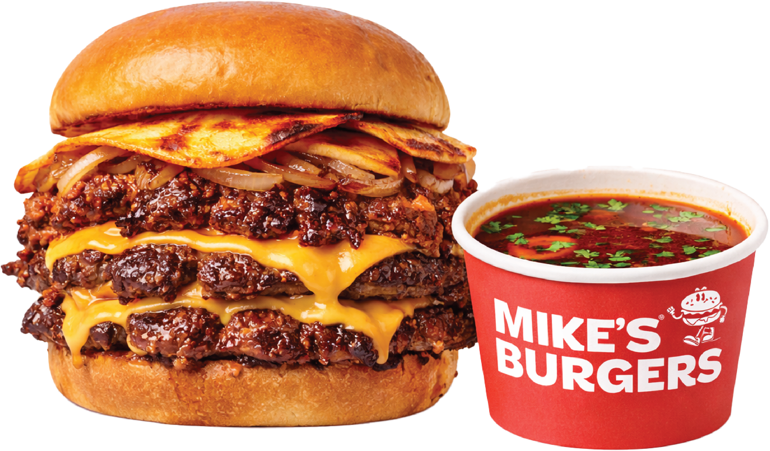 A cheeseburger with two beef patties, melted cheddar cheese, grilled onions, and bun, next to a cup of soda with a straw.