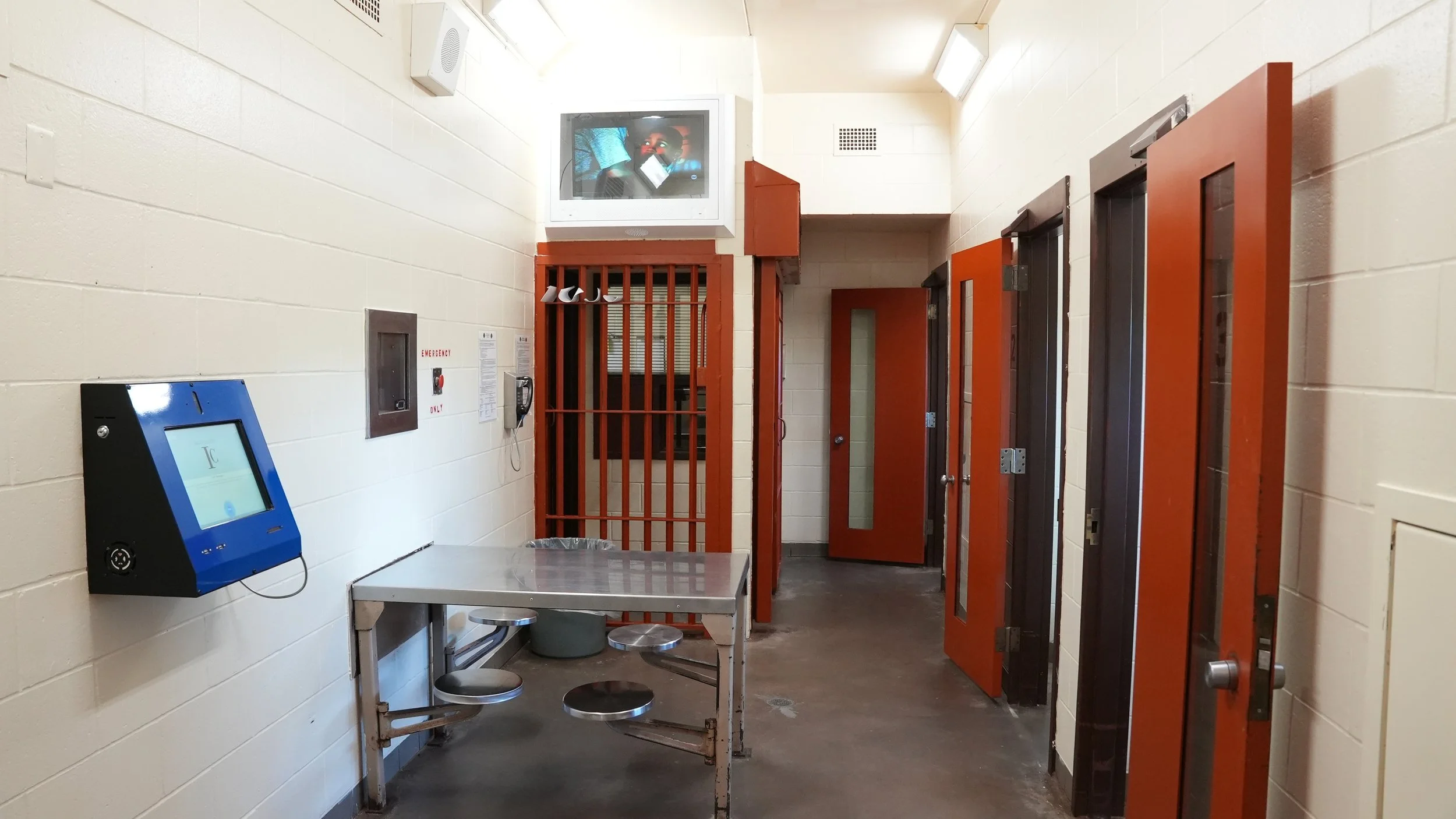 (View of a cell block with four cells.) The current jail lacks enough housing units to provide the proper separation of inmates required for safety and compliance with standards. 