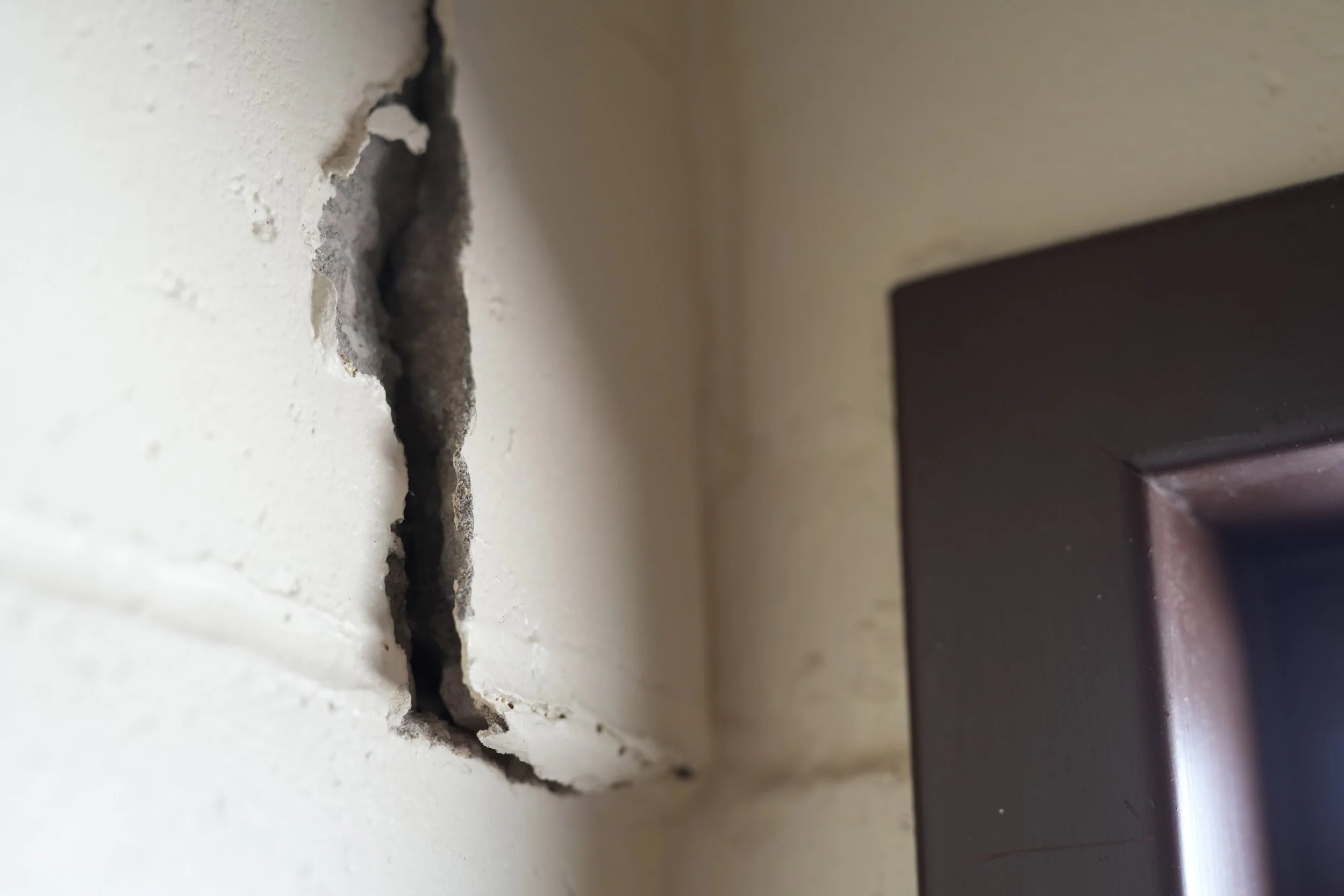 The interior wall in the staff bathroom shows signs of deterioration. 