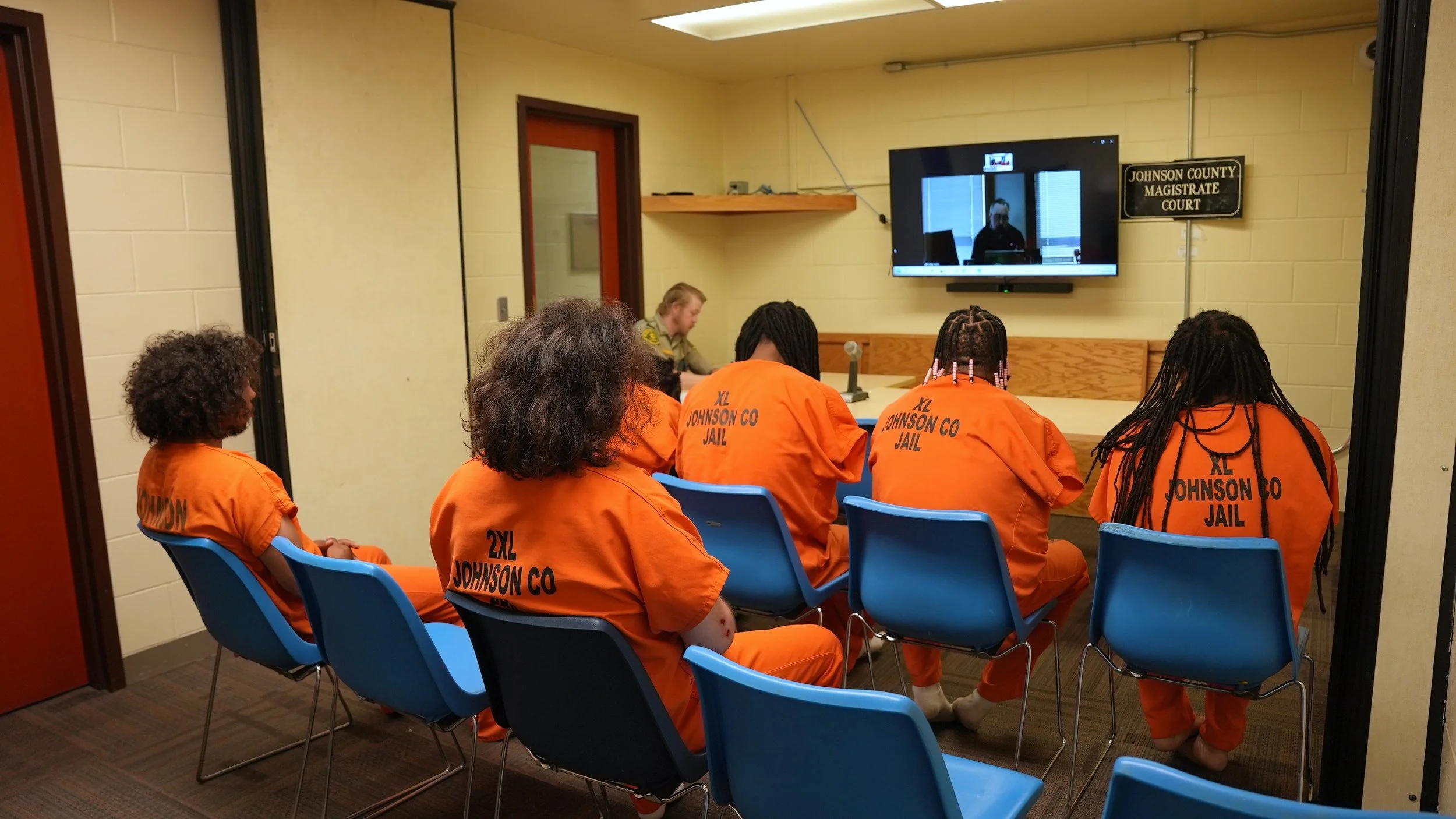 The multipurpose room is used daily for initial court appearances regularly involving 10 or more people. The limited space often results in crowded conditions, and inmates must be escorted in separate groups because the room cannot safely accommodate