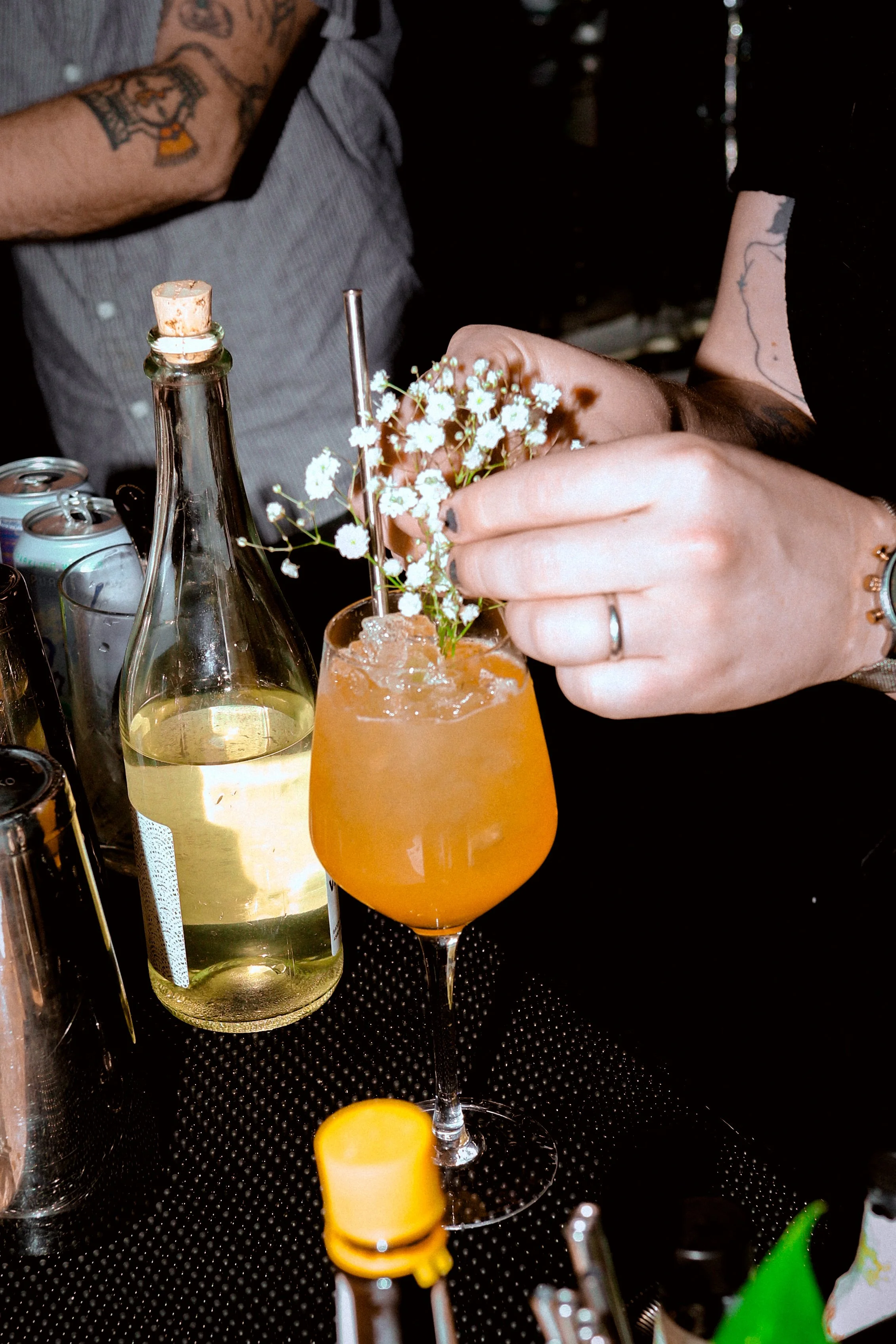Bartender garnishing cocktail