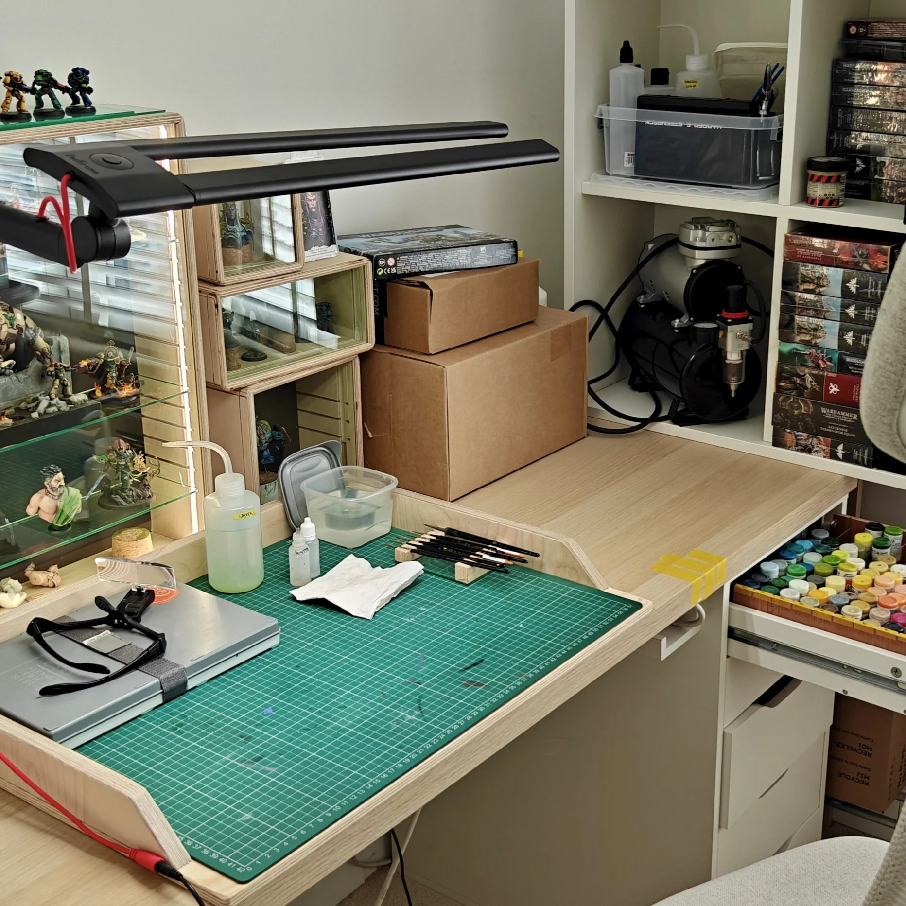 Painting desk with displays, lamp, paints and other material