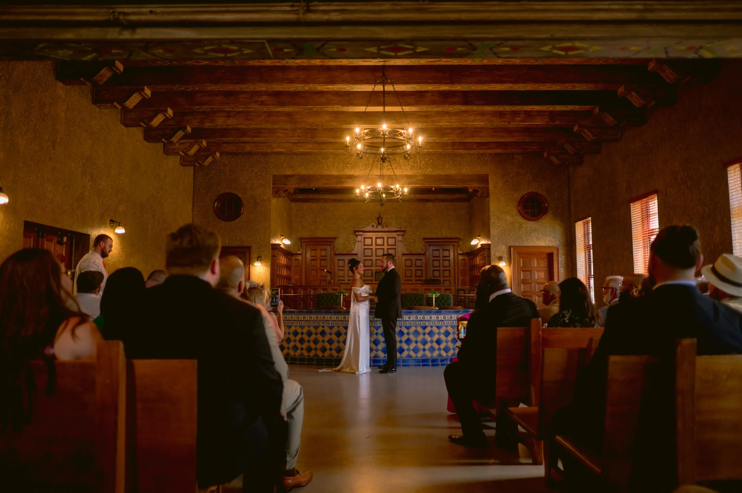 Close up of Marisa and Ben holding hands and exchanging vows inside the affordable, beautiful downtown Sarasota courthouse.