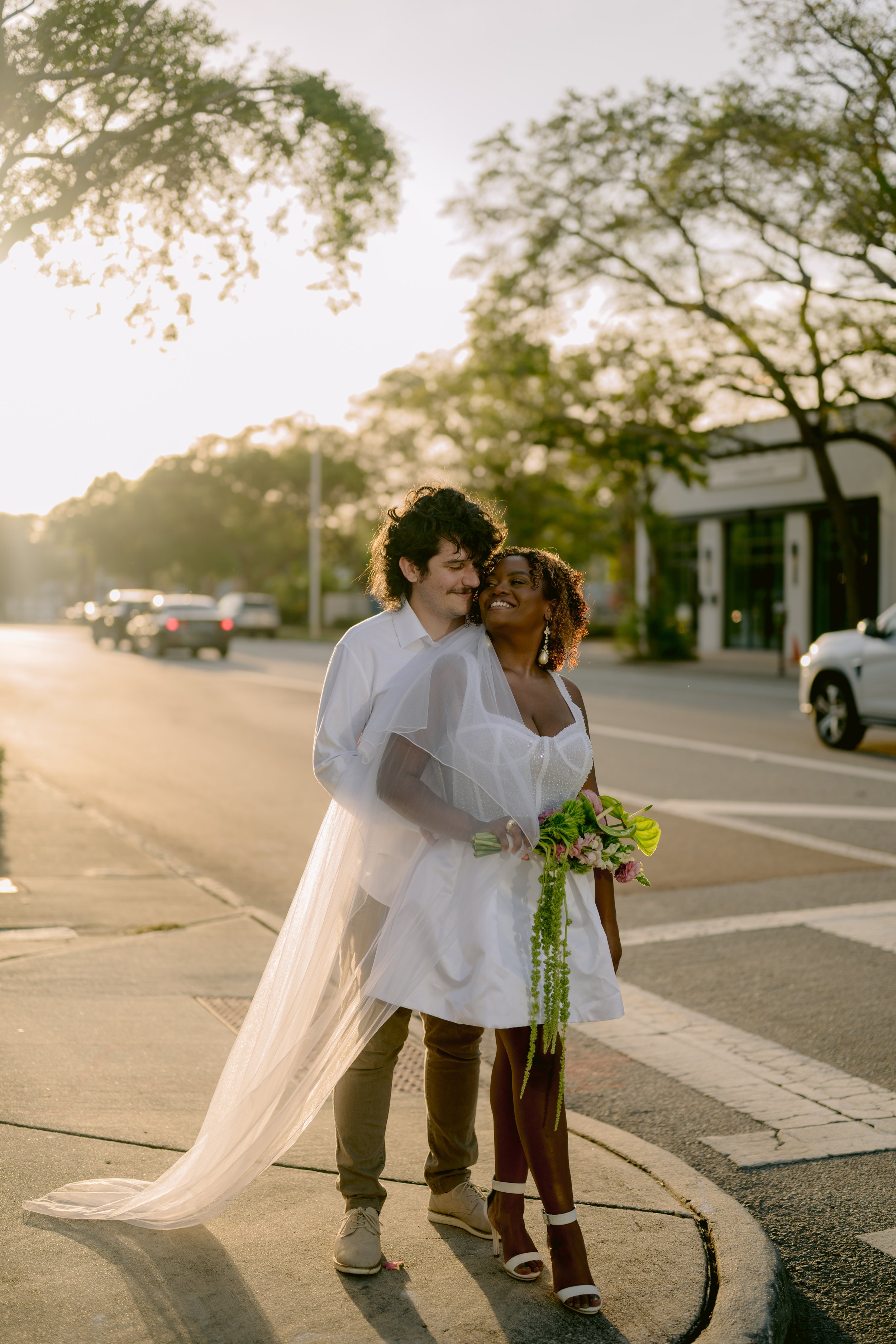Romantic Florida city street crosswalk kiss during a downtown St Pete elopement.jpg