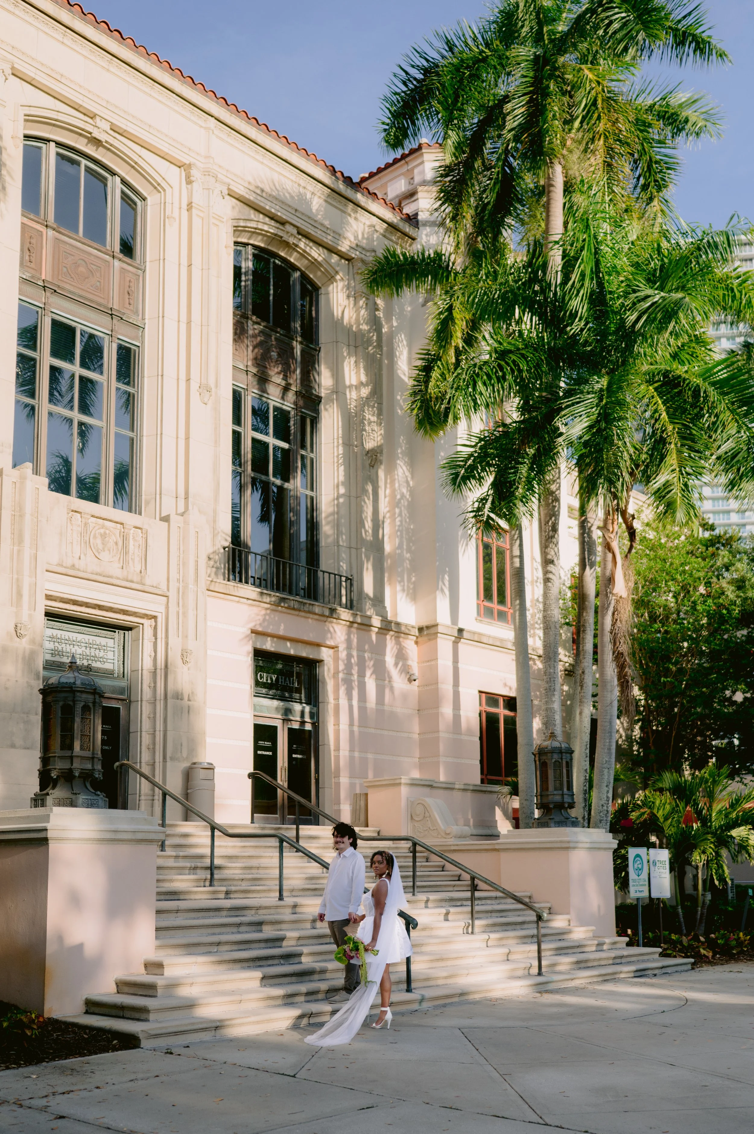 Modern short elopement dress and custom bridal jewelry before a downtown St Petersburg courthouse wedding.jpg