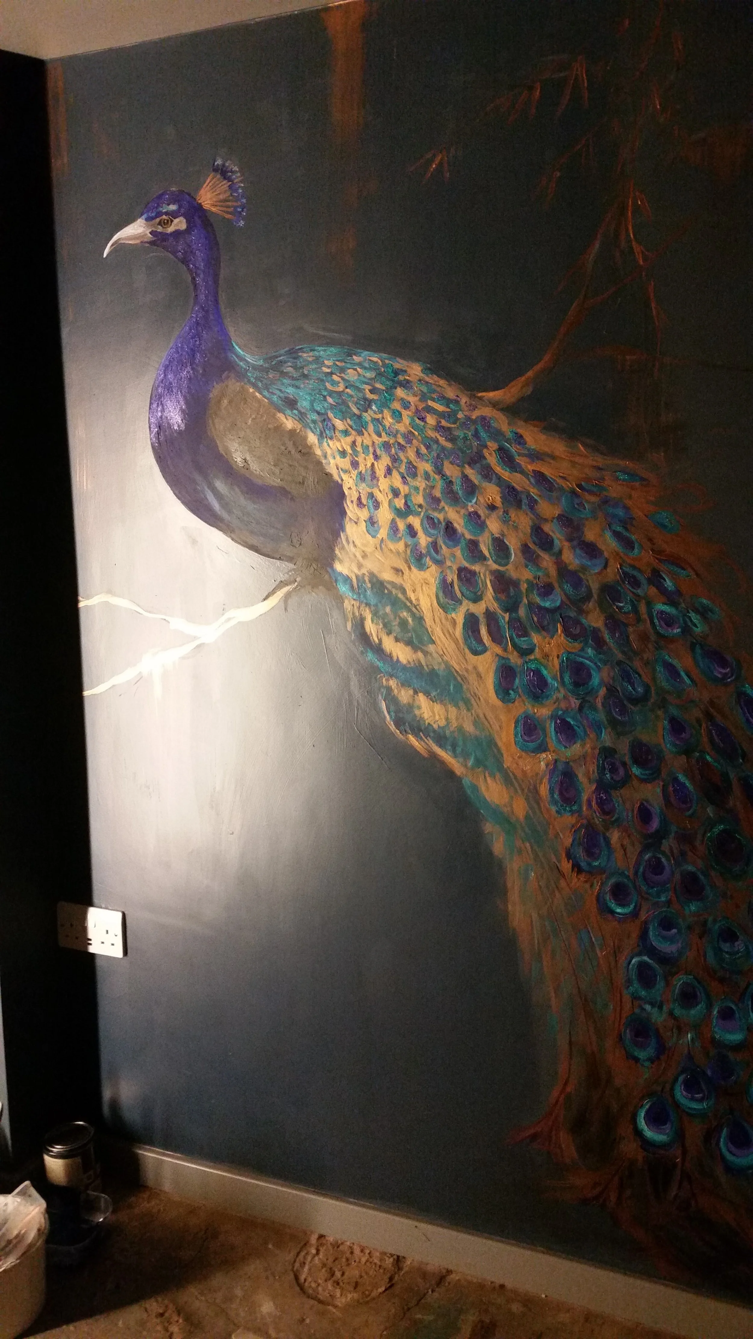 Painting of a peacock with a purple head and vibrant blue, green, and gold feathers on a dark background.