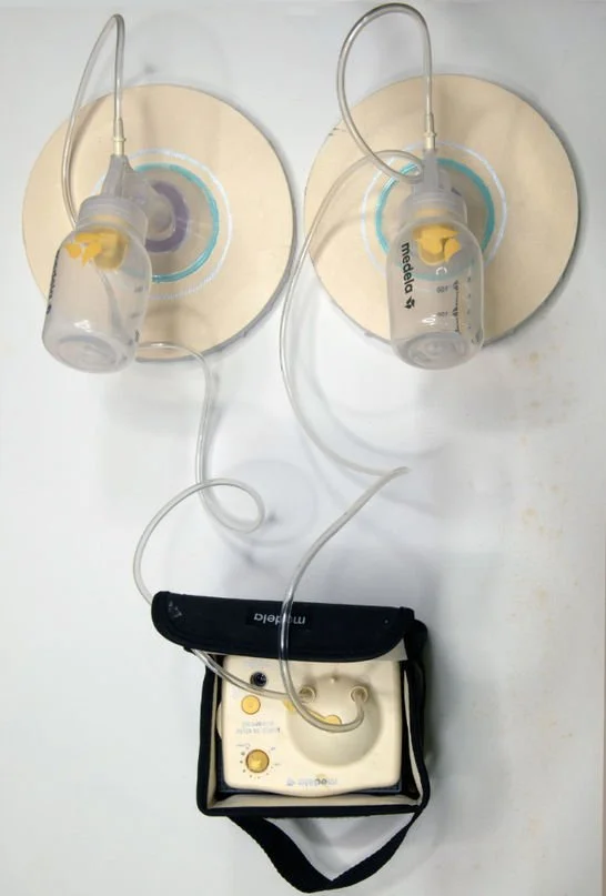 Title: Breast Pump:

Breast Pump is a deeply personal work incorporating acrylic paint, modeling paste, and the Moderna breast pump from my own motherhood journey. The physical presence of the pump transforms the canvas into both artifact and confess
