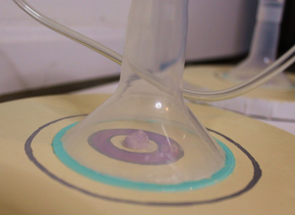 Title: Breast Pump:

Breast Pump is a deeply personal work incorporating acrylic paint, modeling paste, and the Moderna breast pump from my own motherhood journey. The physical presence of the pump transforms the canvas into both artifact and confess