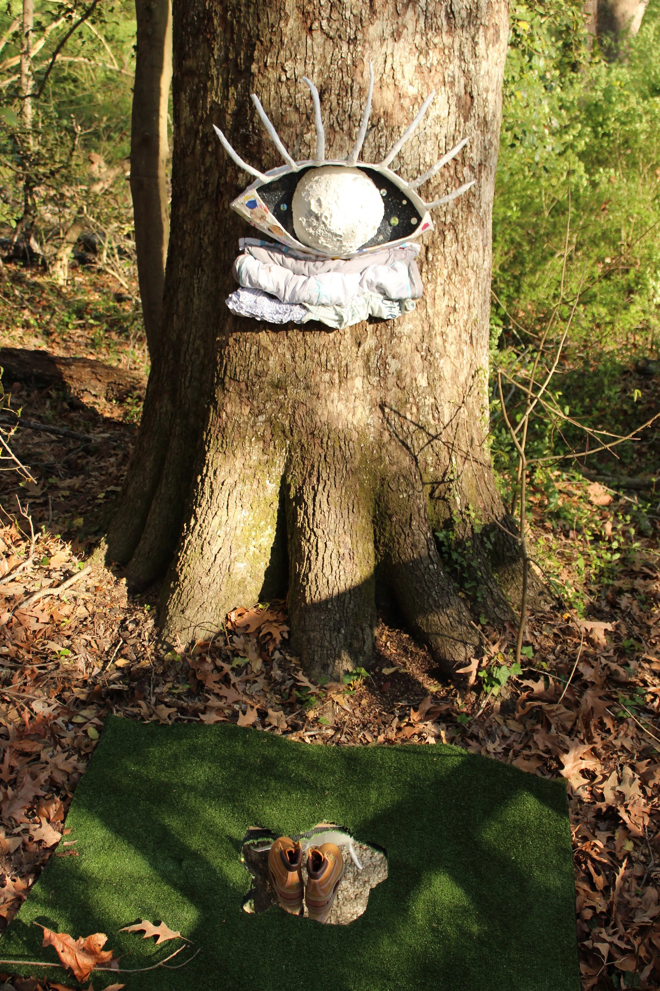 Title: A Mother’s Perspective:

This mixed-media sculptural work takes the form of a large eye—its gaze constructed from circular cutouts of artwork and handmade paper created in collaboration with a child over the course of two years. The piece was 