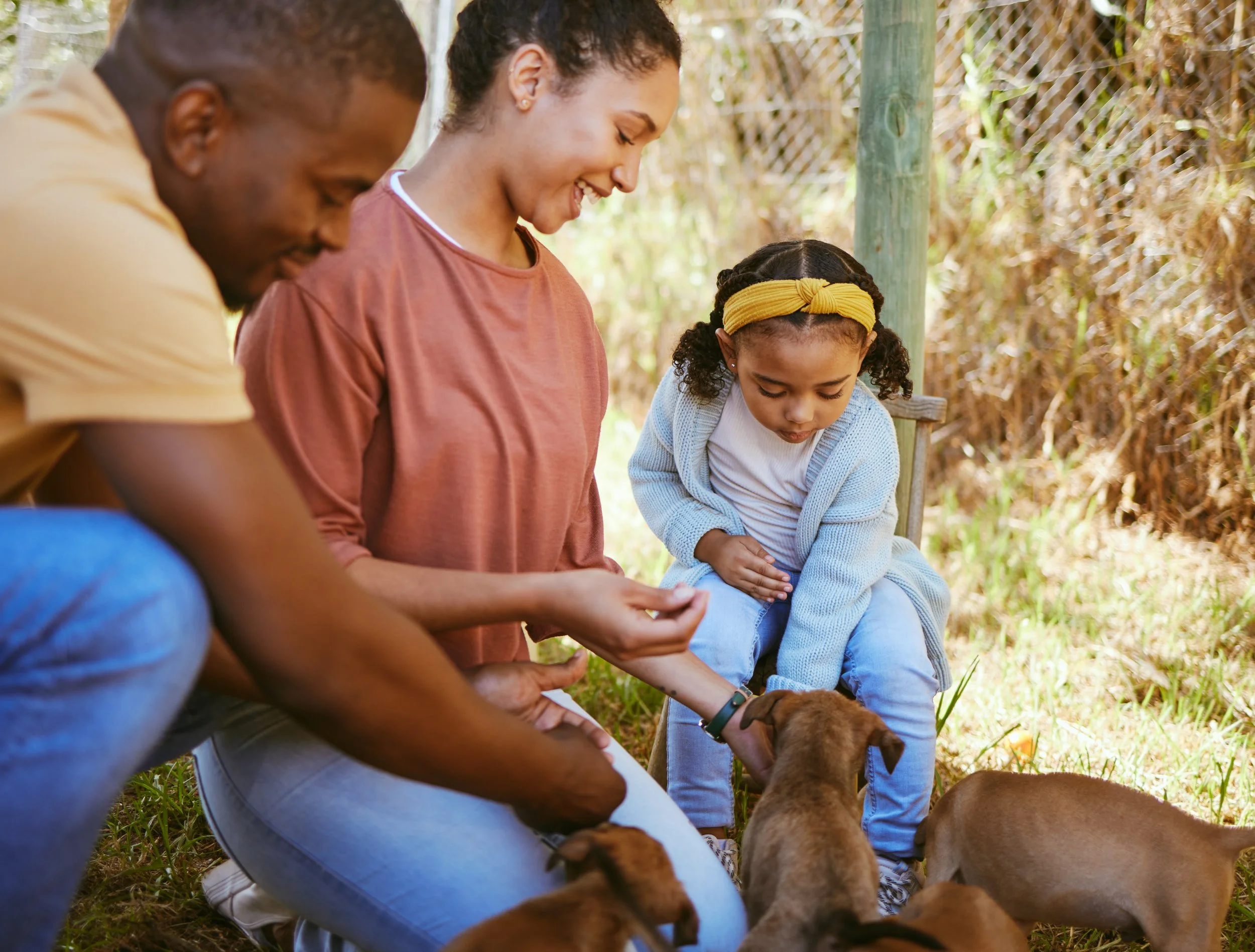 black-family-mother-and-father-with-child-puppie-2023-11-27-04-57-43-utc.jpg