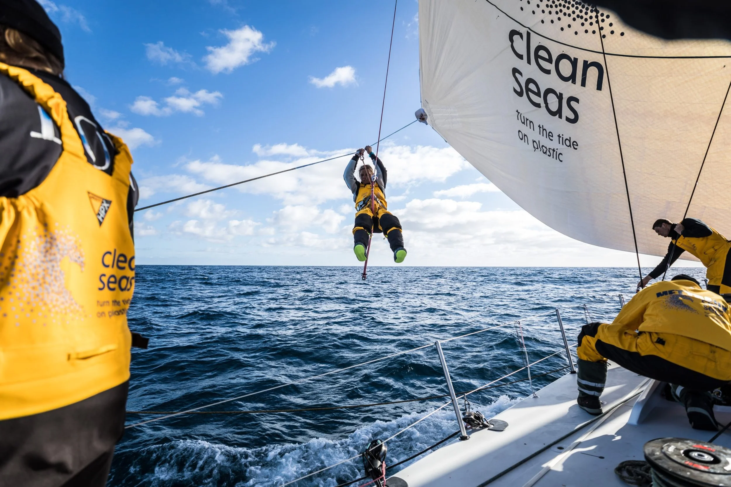Liz Wardley setting a sail aboard an offshore racing yacht.