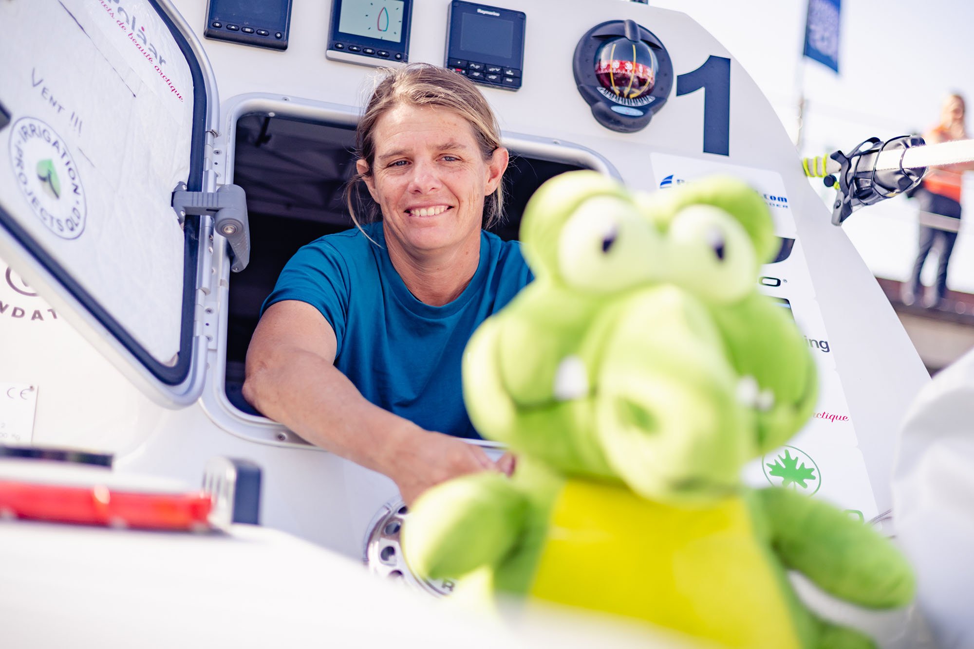 Liz Wardley aboard her ocean rowing boat with her green crocodile mascot during her solo Atlantic crossing.