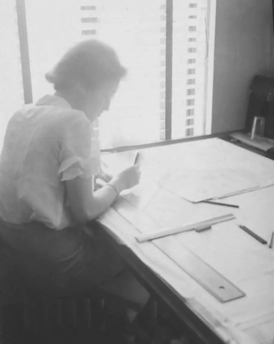 Lisl at drafting board 1930s