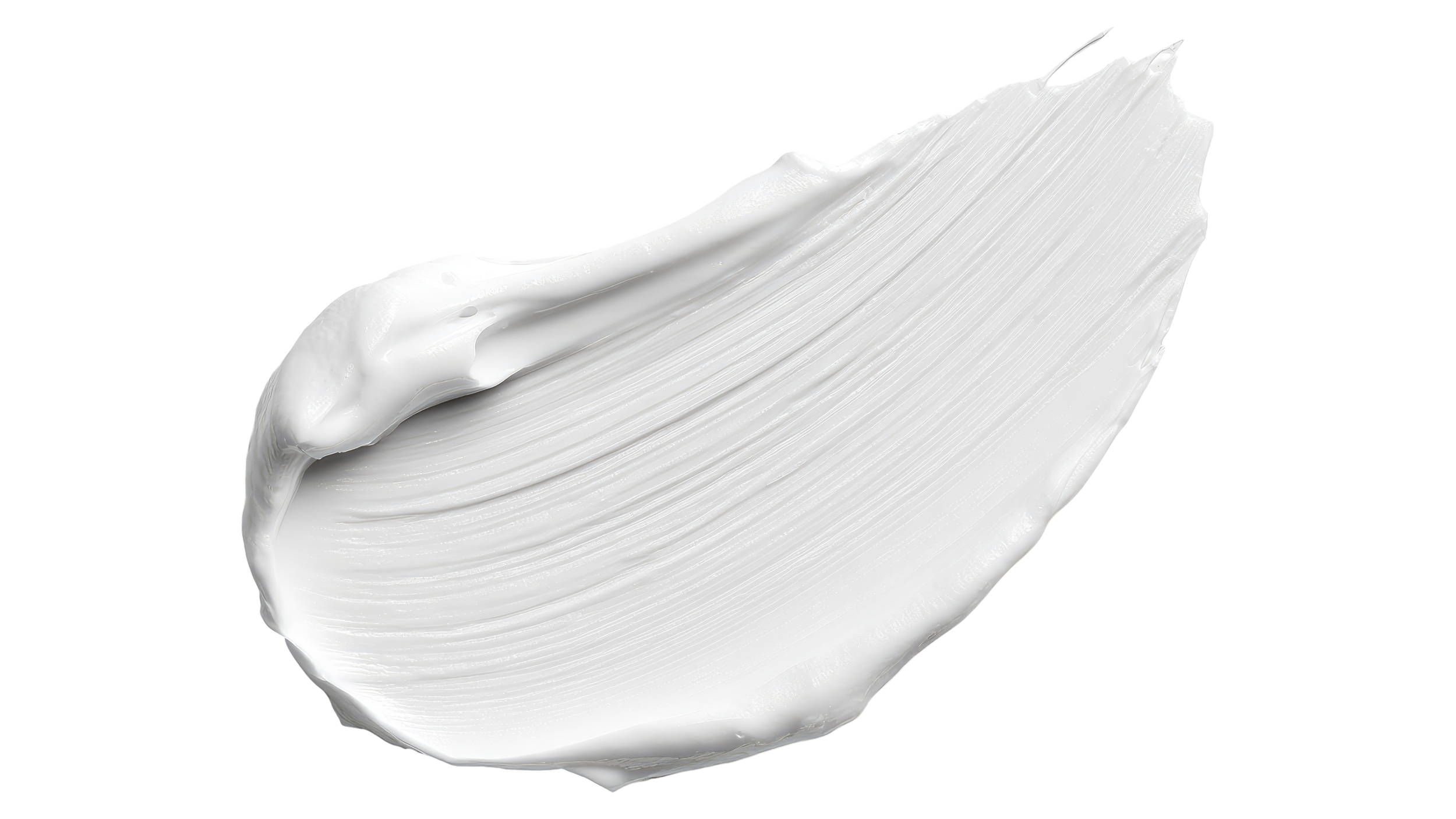 Close-up of white cream or lotion on a black background.
