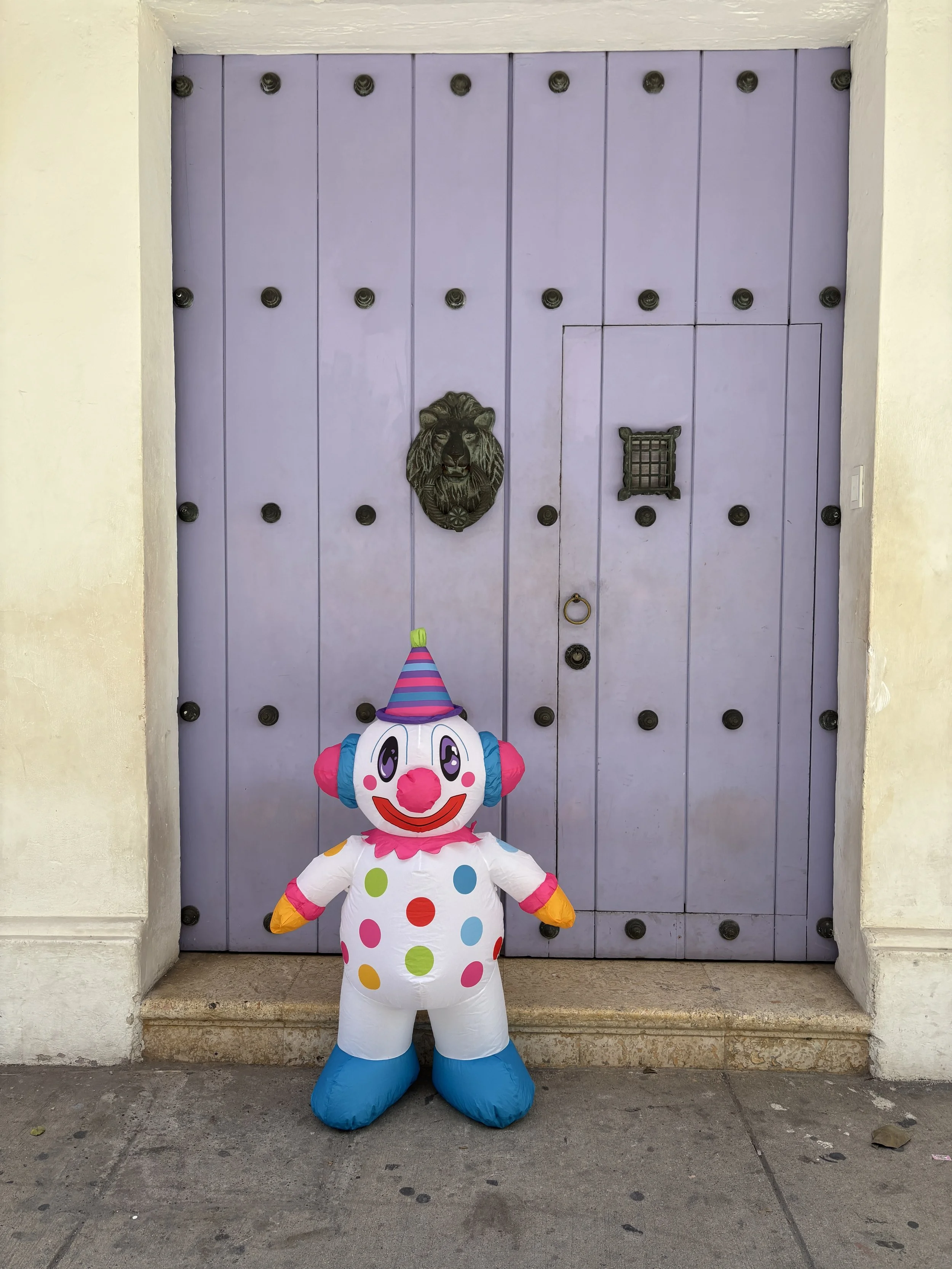 Cutesy is a 4-foot magical inflatable for ages 4 to 8. Cutesy has a white face and a polka-dot body. Cutesy wears a cone-shaped party hat. Cutesy is waving. Cutesy is kid-designed and brings colorful joy. Cutesy is for celebrations and birthdays.