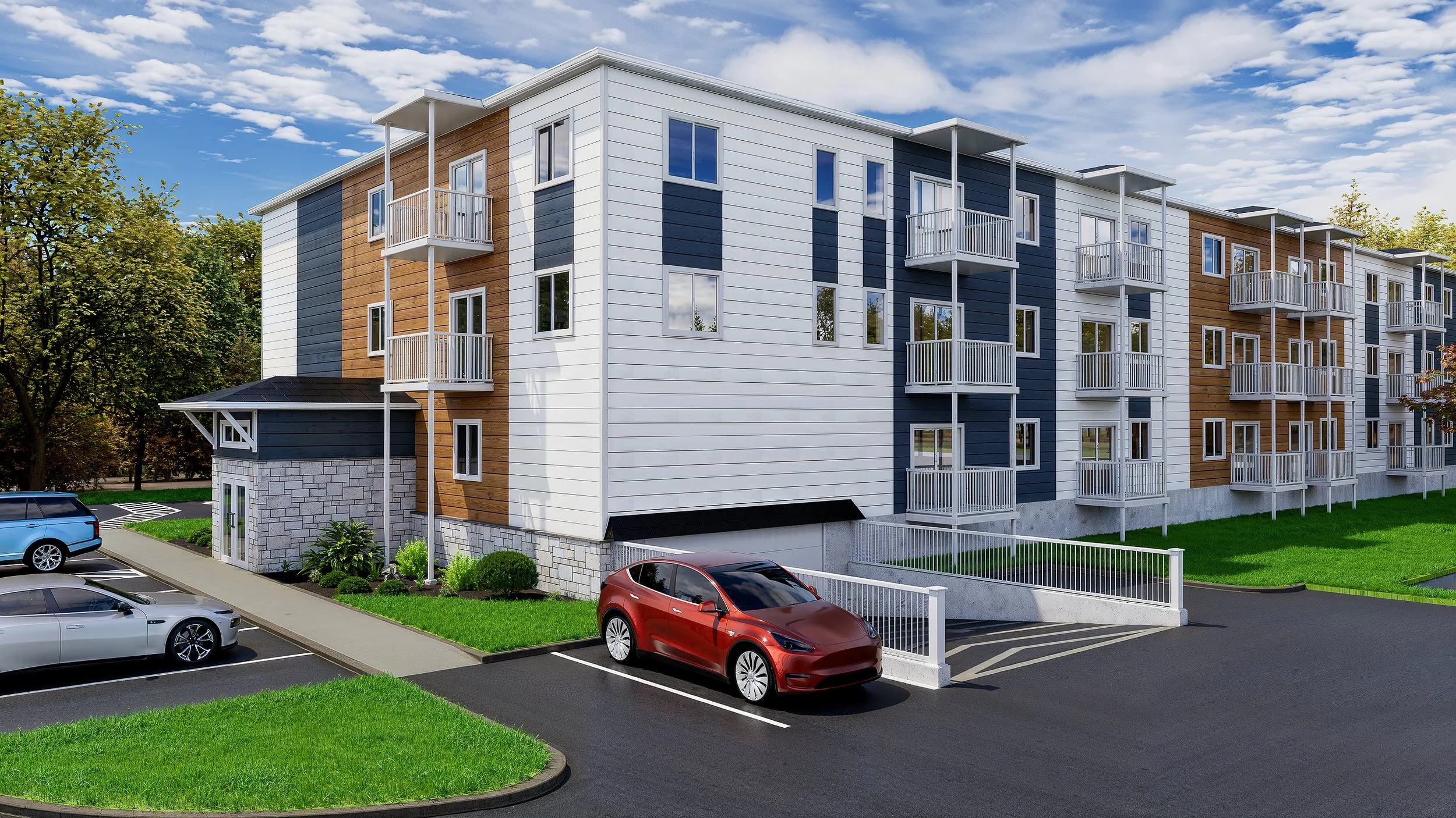 Modern multi-story apartment building with white, blue, and wood siding, balconies, and a parking lot with cars.