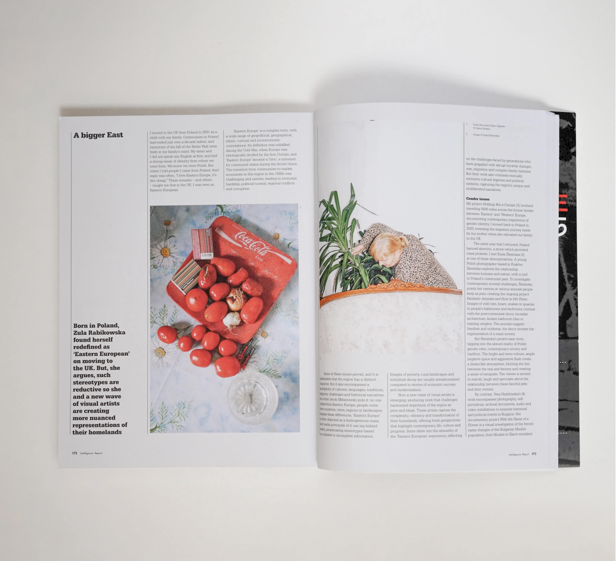 Open magazine with article titled "A bigger East" showing a colorful photograph of a Coca-Cola box surrounded by cherry tomatoes on the left page, and a person with blonde hair wearing a patterned shirt, leaning over a potted plant on the right page.