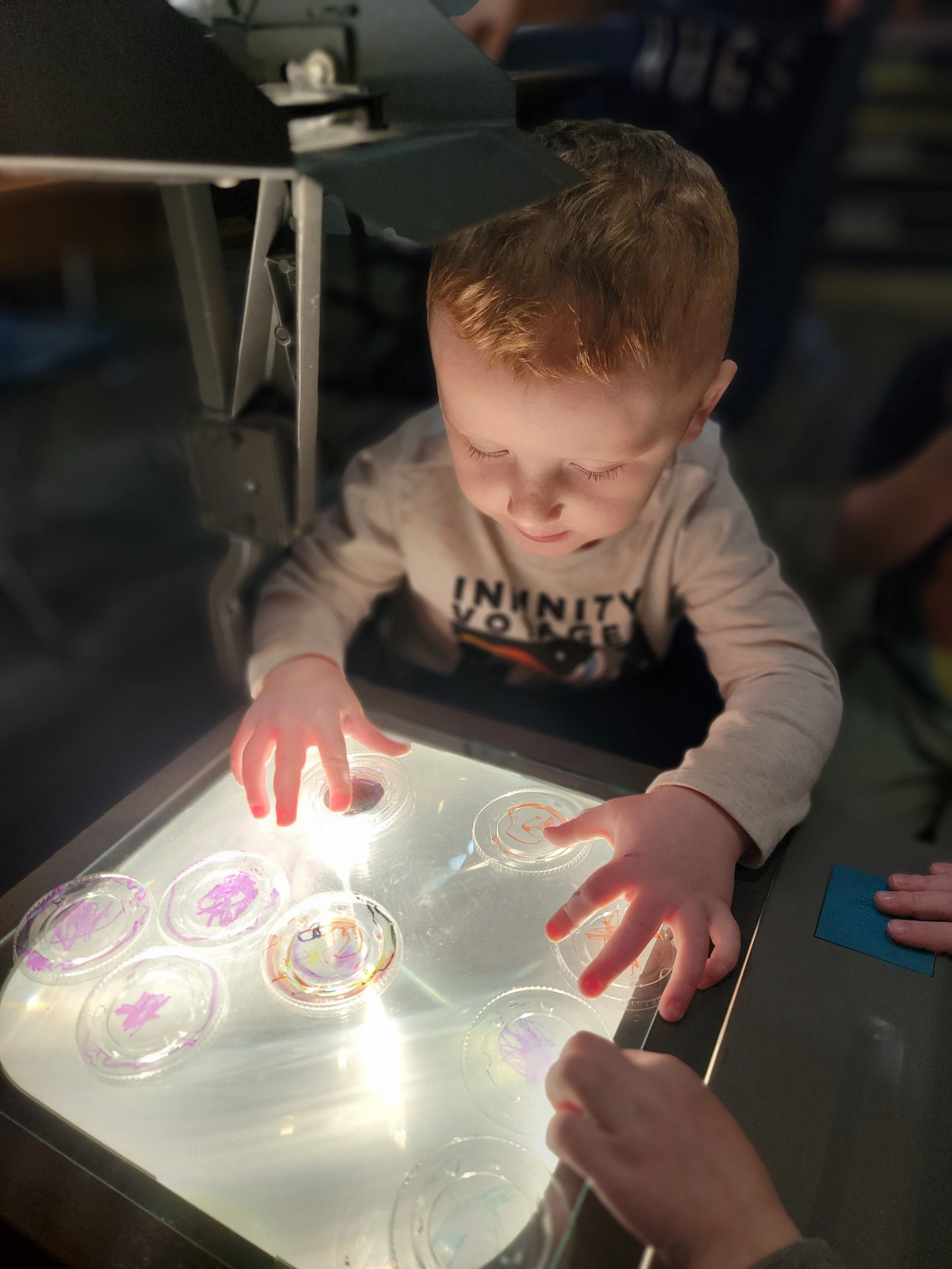 GO Explore Childcare & Preschool Toddler Playing with Light