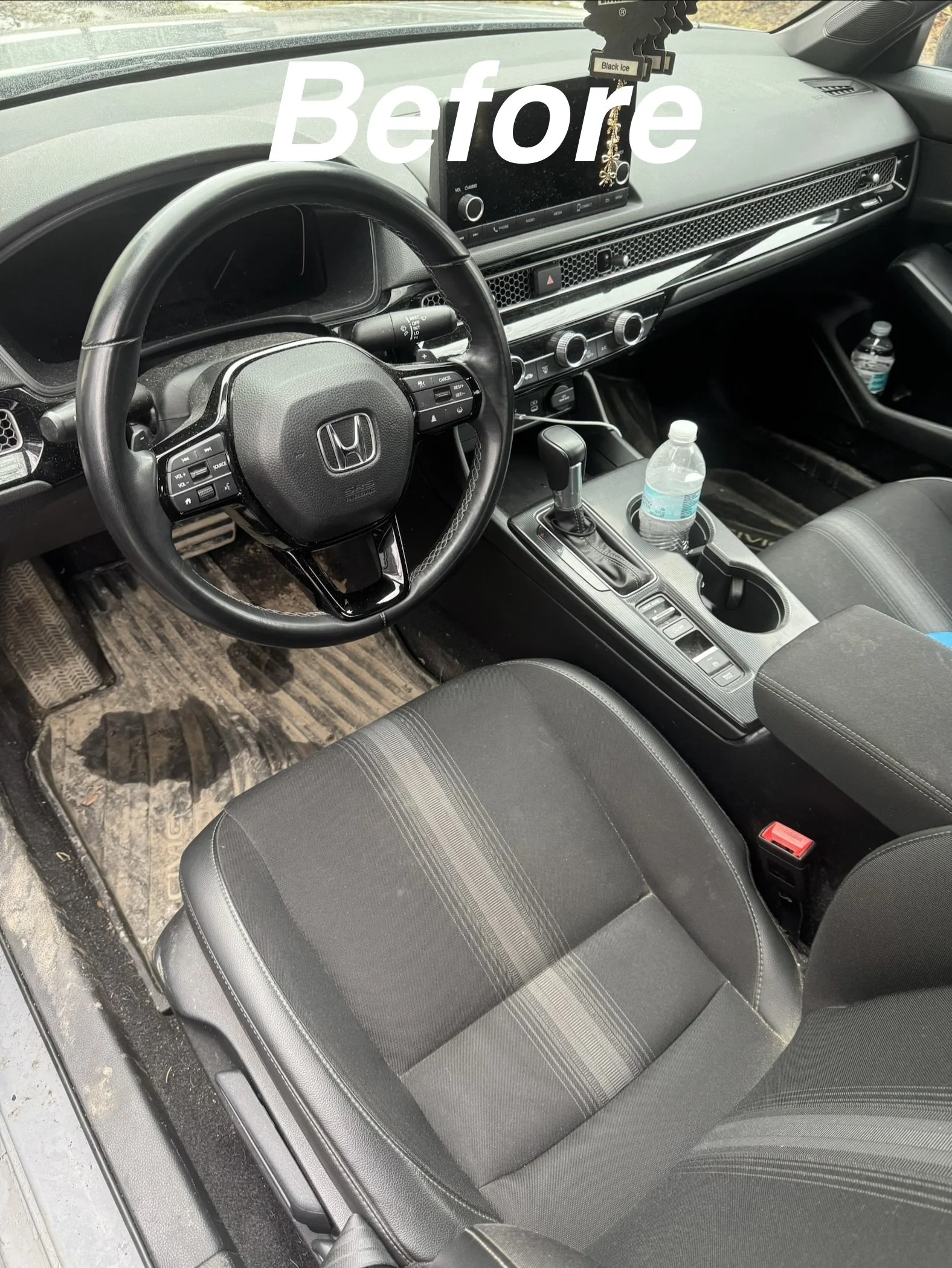 Interior of a Honda car showing the steering wheel, dashboard, gear shift, two bottles of water, and front seats, with a 'Before' label overlayed.