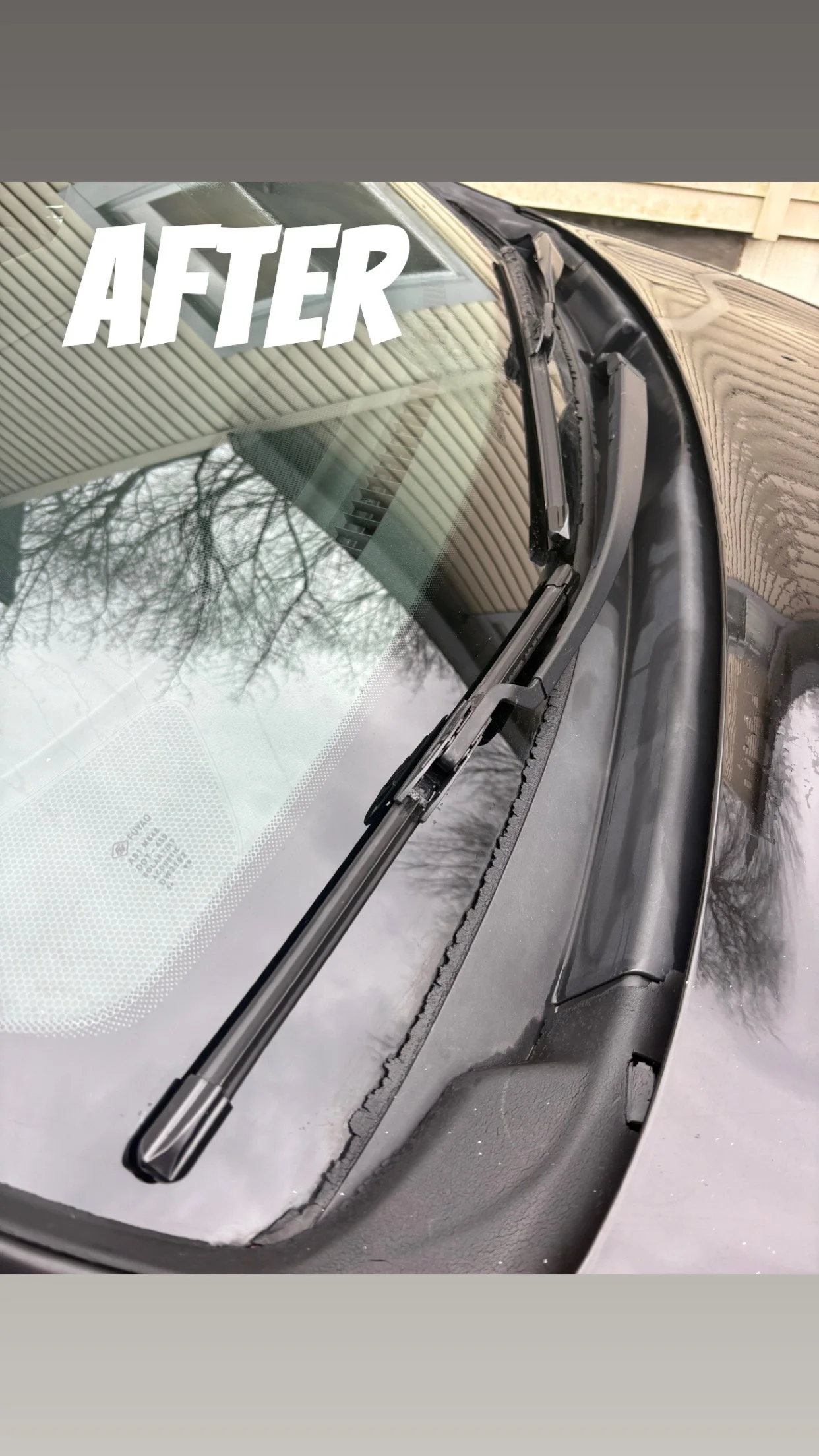 Close-up of a car windshield with a cleaned windshield wiper installed, with the word 'AFTER' displayed in large white letters.