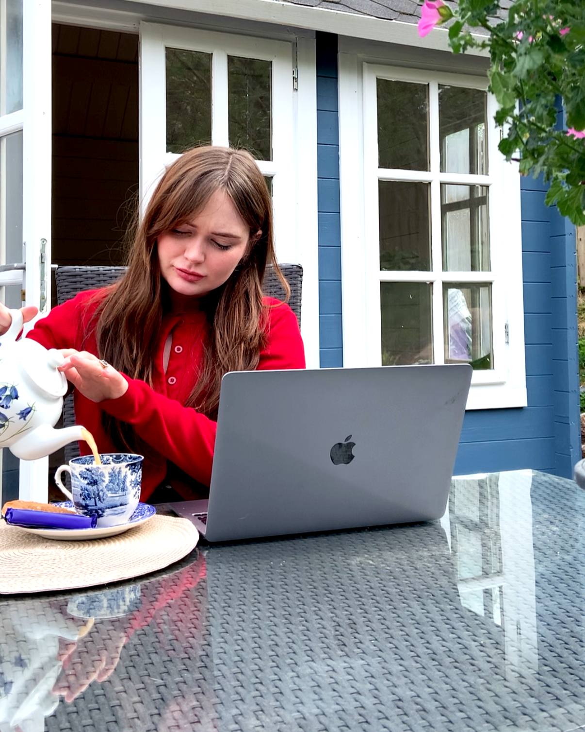 Two glasses of coffee and a white headphone resting on a table.