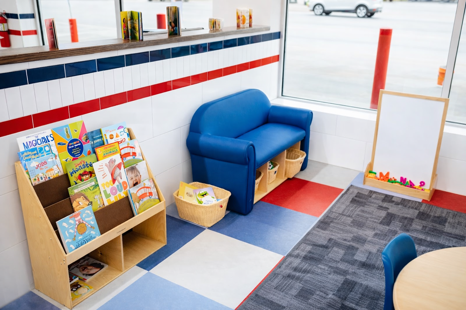 Kids reading and play area inside Laundry Luv San Angelo 19th Street laundromat.