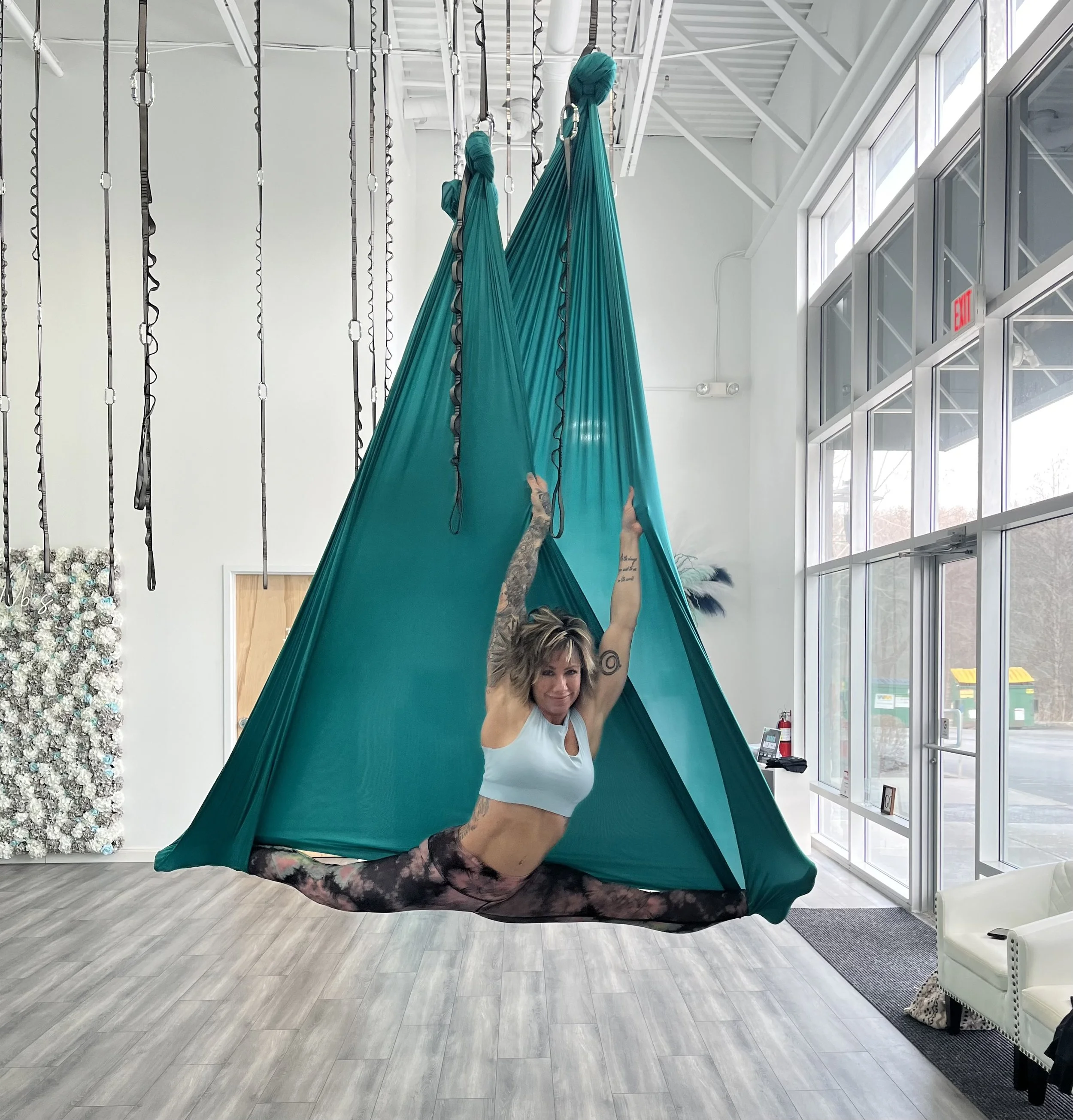 Colleen, former bodybuilder turned yoga instructor, demonstrating strength and balance through a mindful yoga pose.