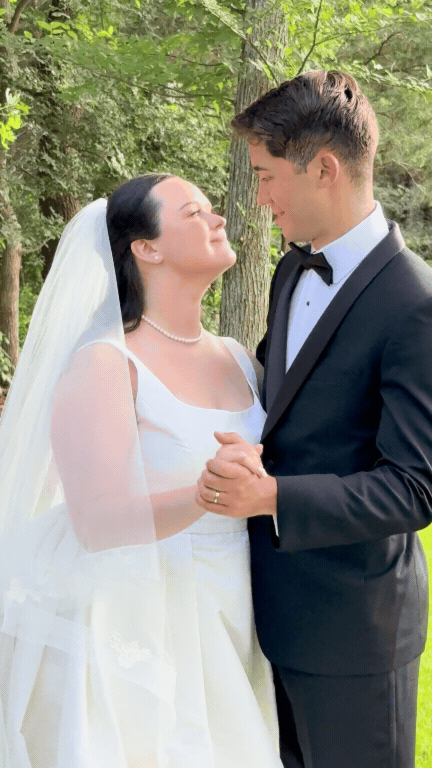 Bride and groom holding hands and gazing into each other's eyes outdoors. Love Letty Content, Luxury Wedding Content Creation in Dallas Texas.