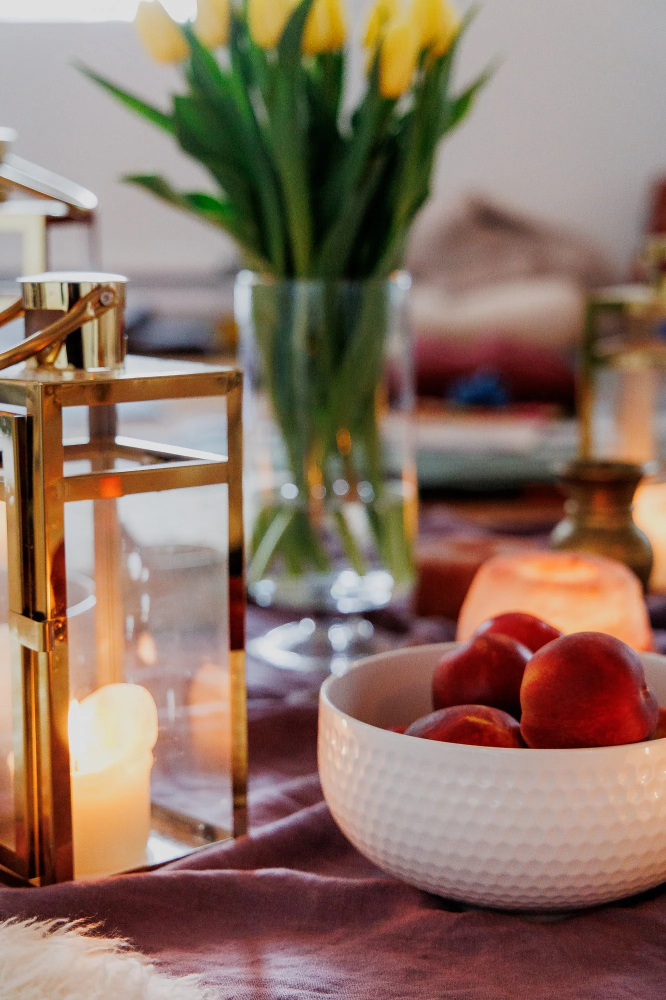 yellow flowers next to a candle in the yoga room