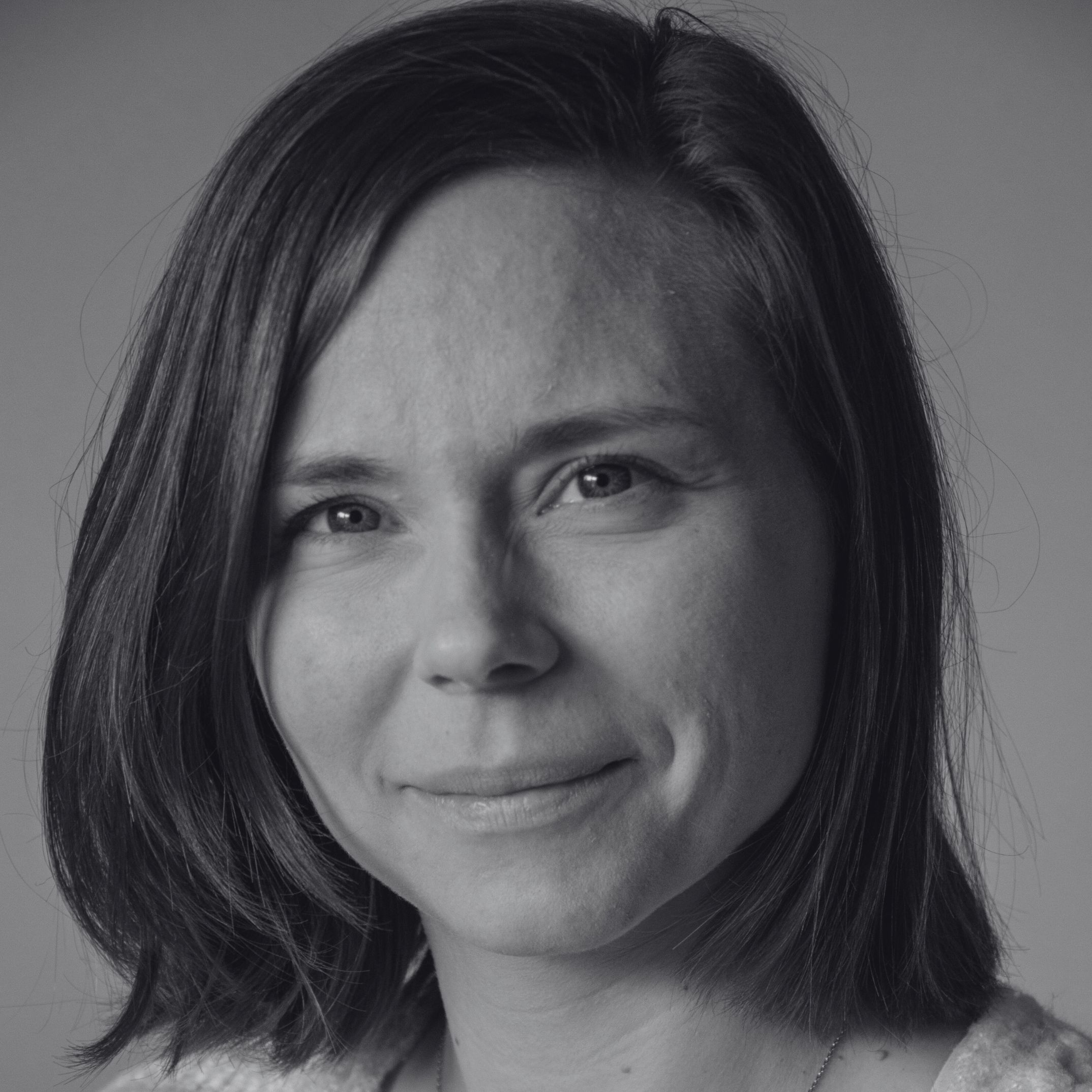 Black and white photo of a woman with short hair
