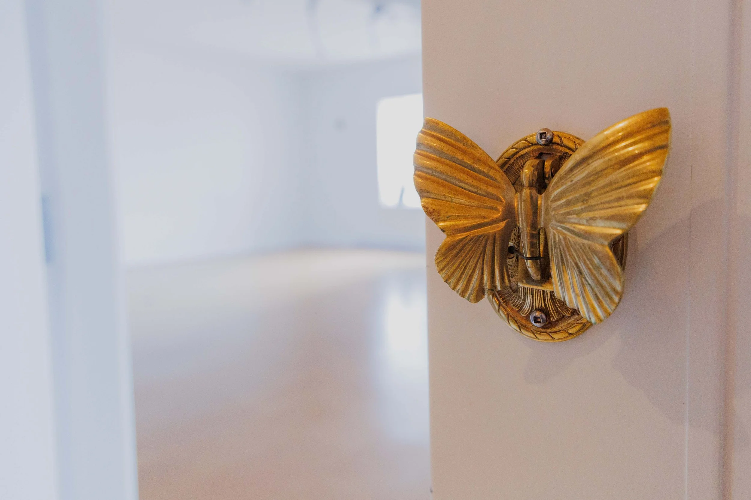 Bright studio space with a butterfly door handle