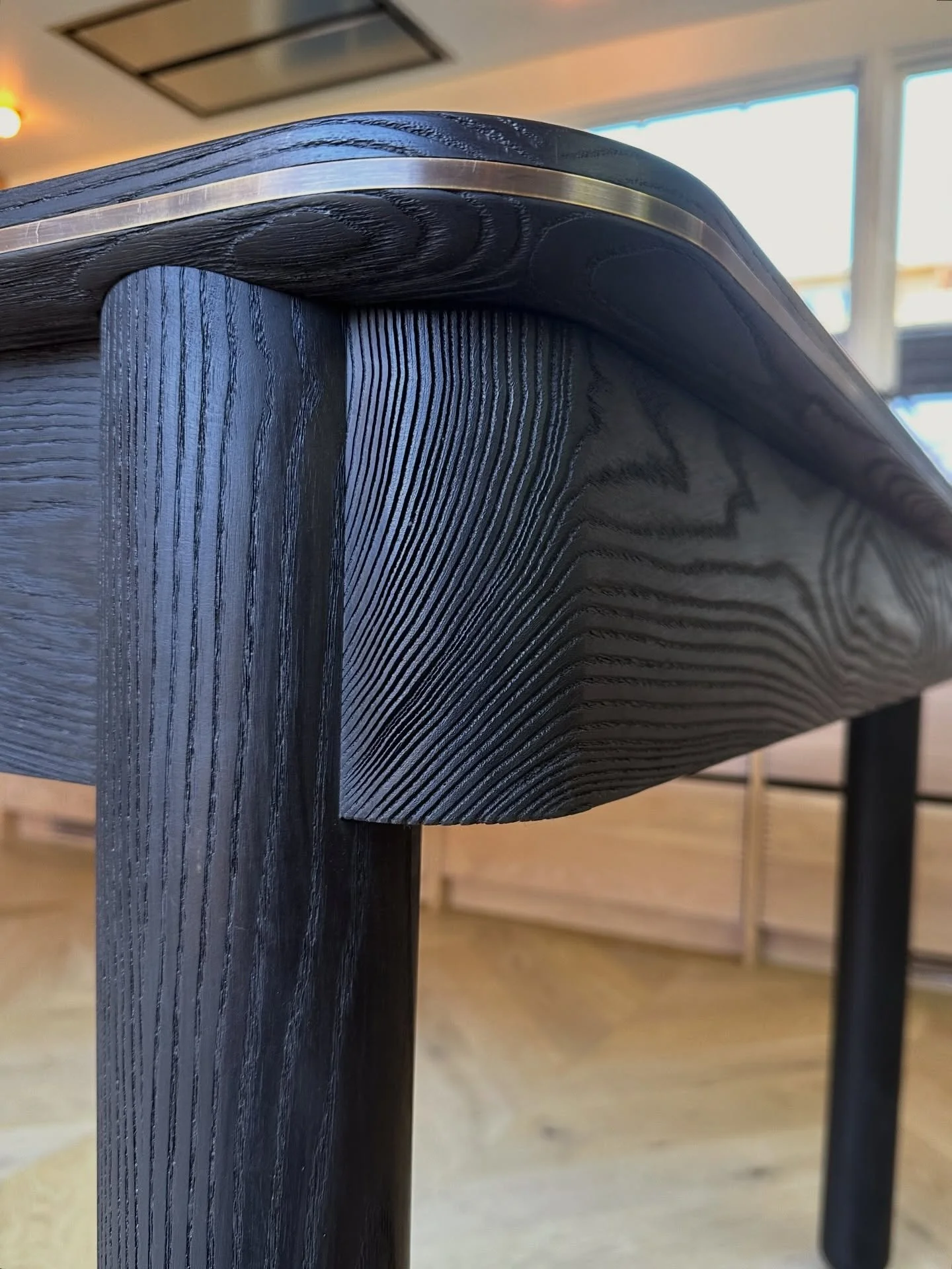 Photos of the finished ash and bronze kitchen island.

Designed by: @studiomuir + @noa_sf