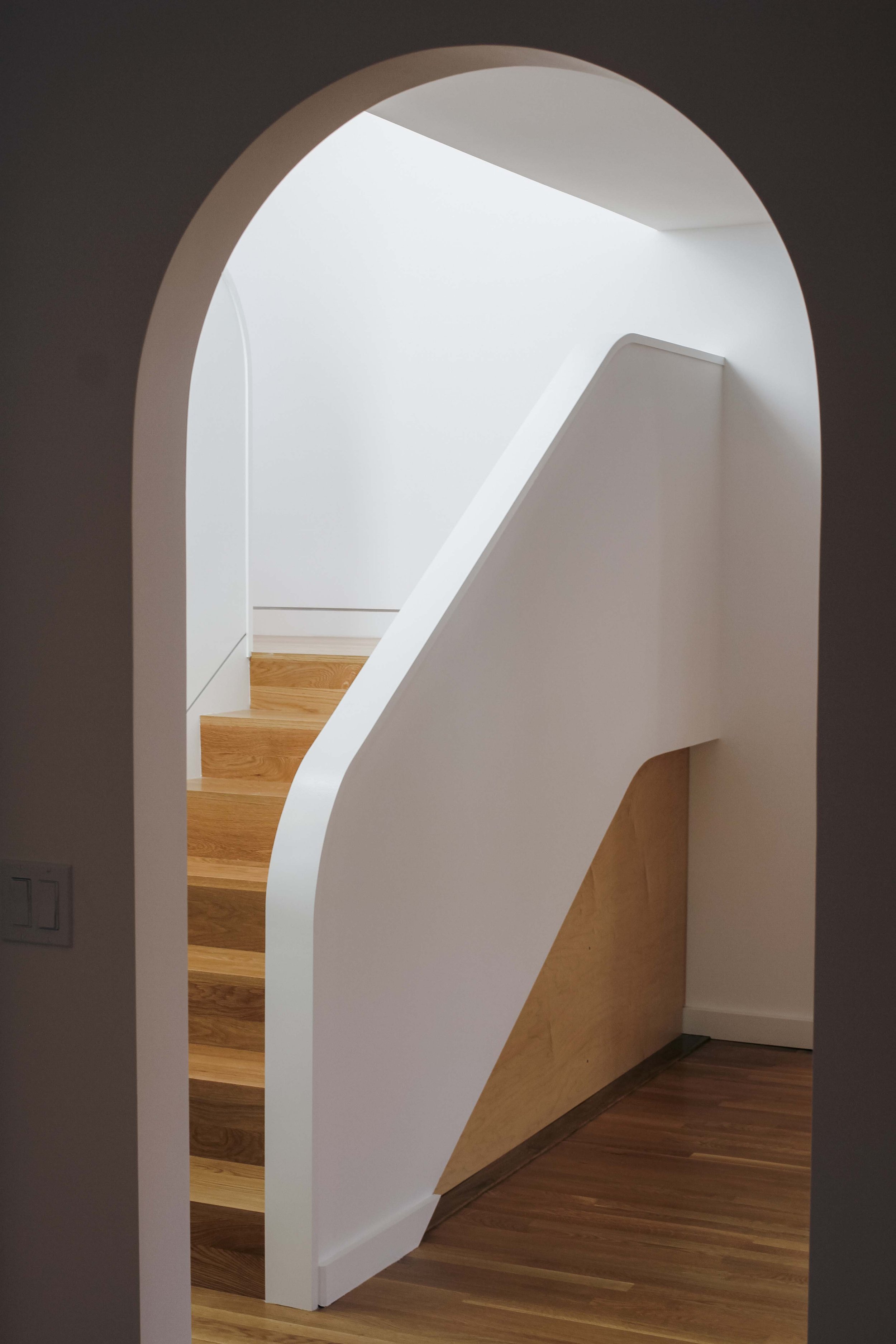 Rockridge2ndStory_StaircaseThroughArchedDoor.jpg
