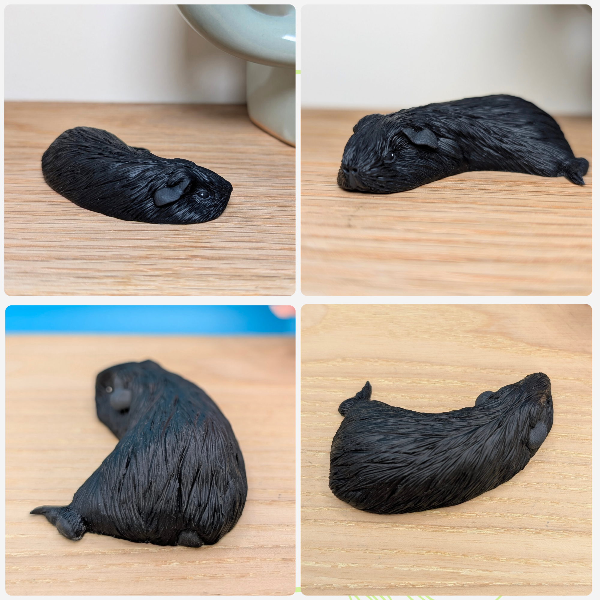 Black Sleeping Guinea Pig Sculpture