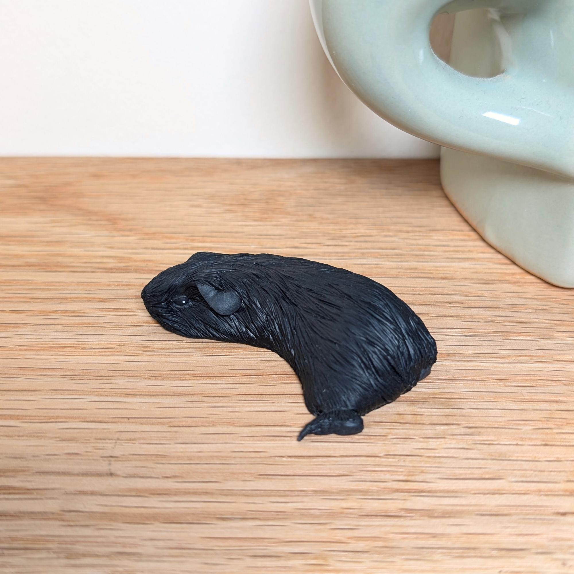 Black Sleeping Guinea Pig Sculpture