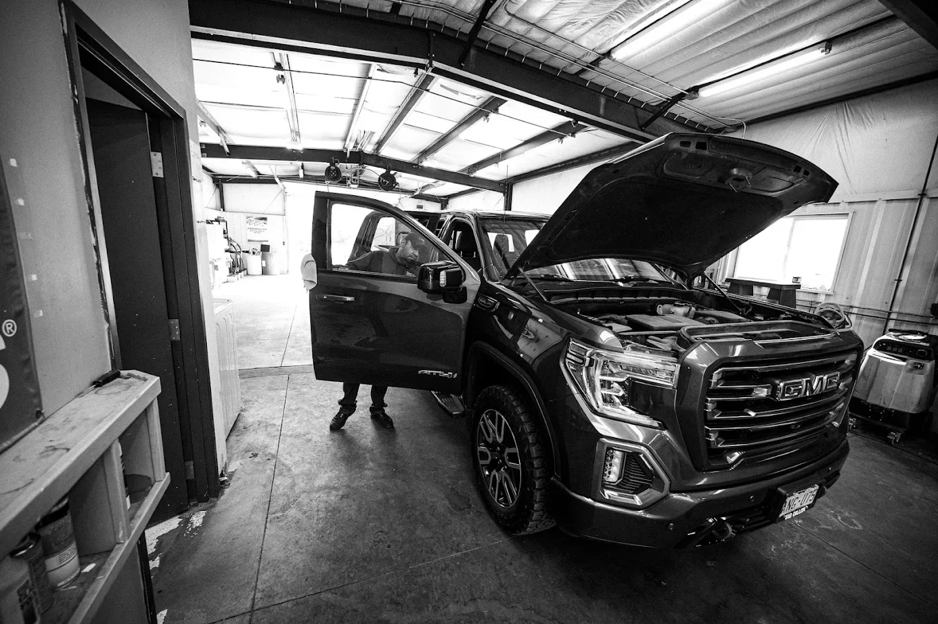 Team member providing full-service car wash and detailing at Casey’s Car Wash