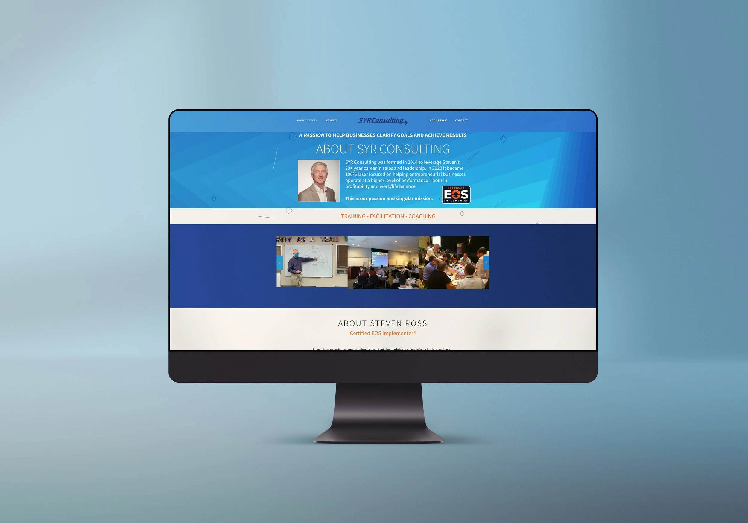Computer monitor displaying a website for SYR Consulting, featuring about section, photos of a presenter and a classroom, with a blue theme.