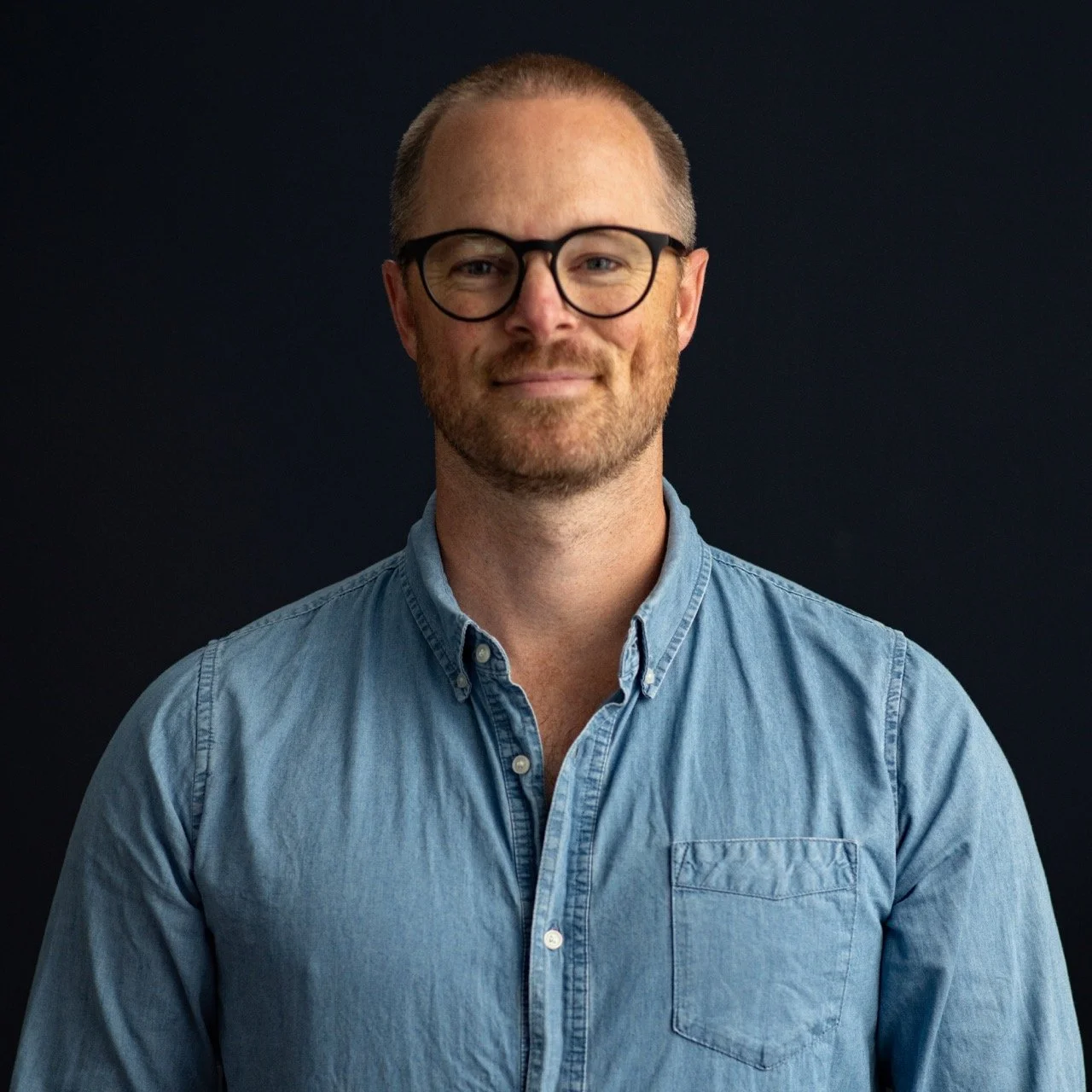 Smiling Hamish McCormick Frank Productions portrait team photo