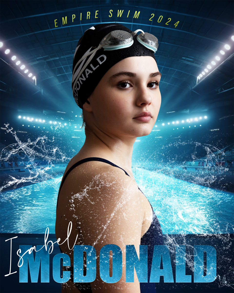 Young female swimmer wearing a black swim cap and goggles at an indoor swimming pool, with text 'Empire Swim 2024' and 'Isabel McDonald'.