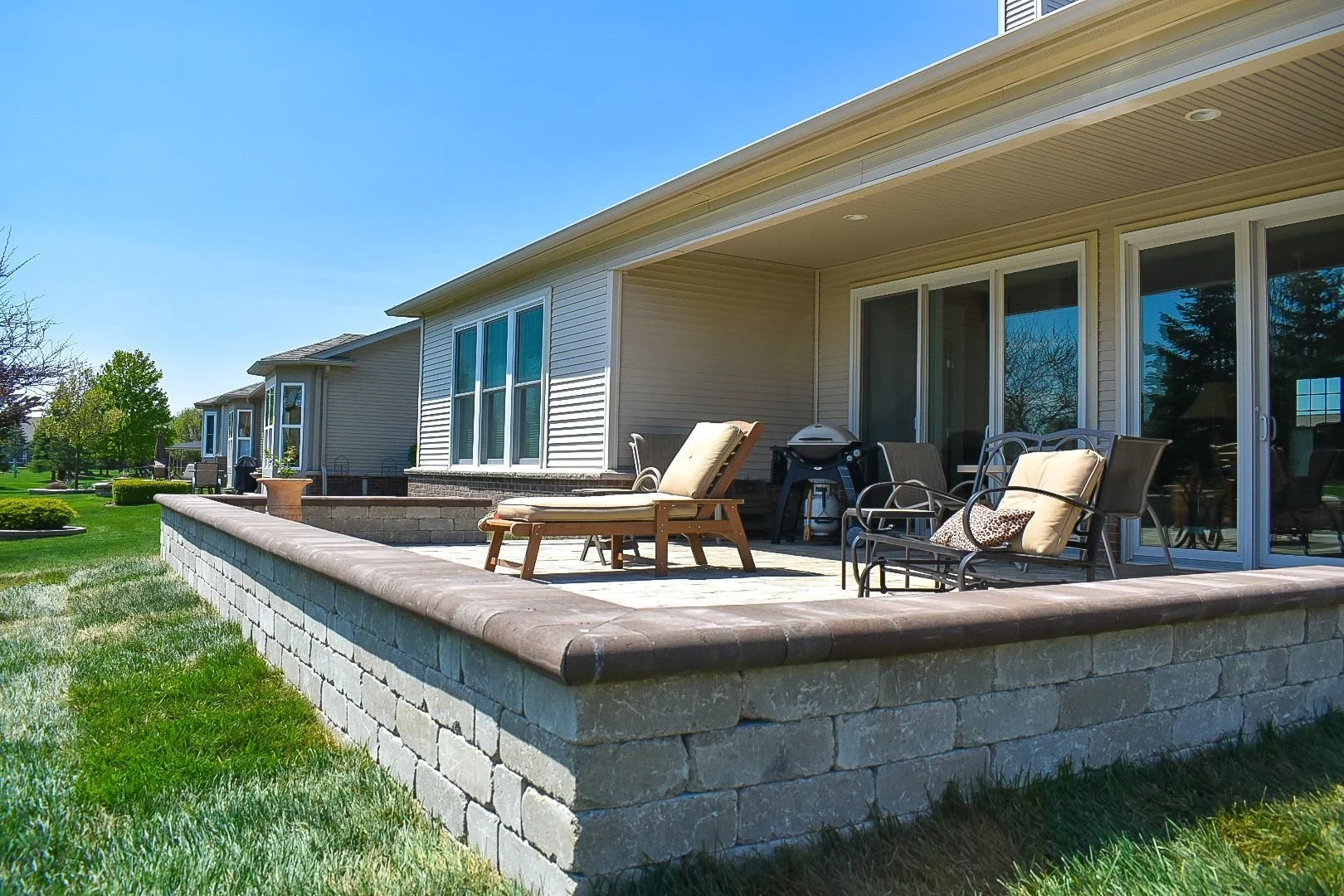 Creating Functional Elegance With a Retaining Wall &amp; Paver Patio in Sumpter Township, MI