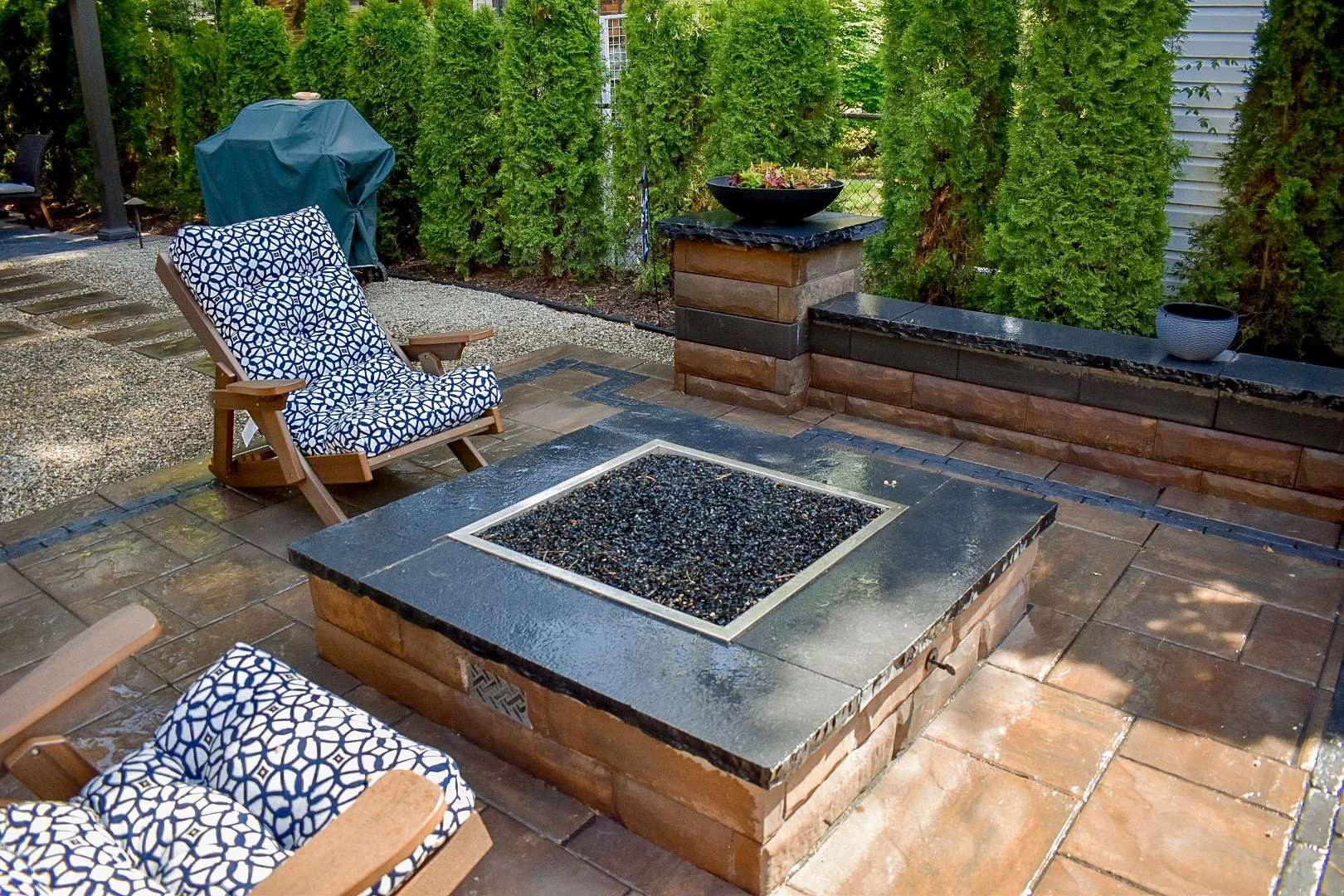 Create a Cozy Ambiance in Woodhaven, MI with Landscape Lighting and a Fire Pit
