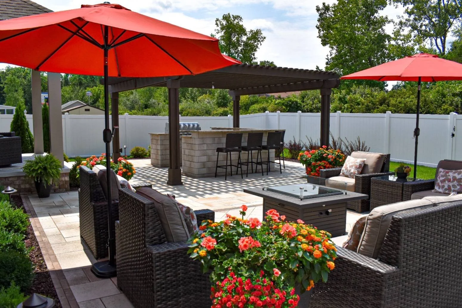 Outdoor living space with paver patio, seating area, and landscape design creating a functional backyard in Woodhaven, MI