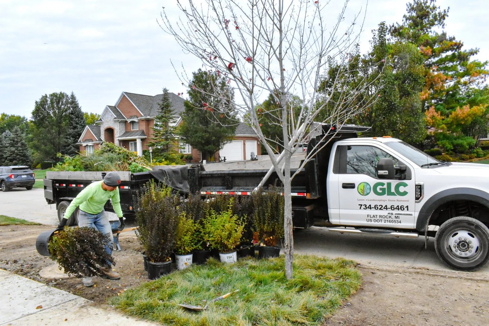 Landscaping crew installing paver patio in Flat Rock MI