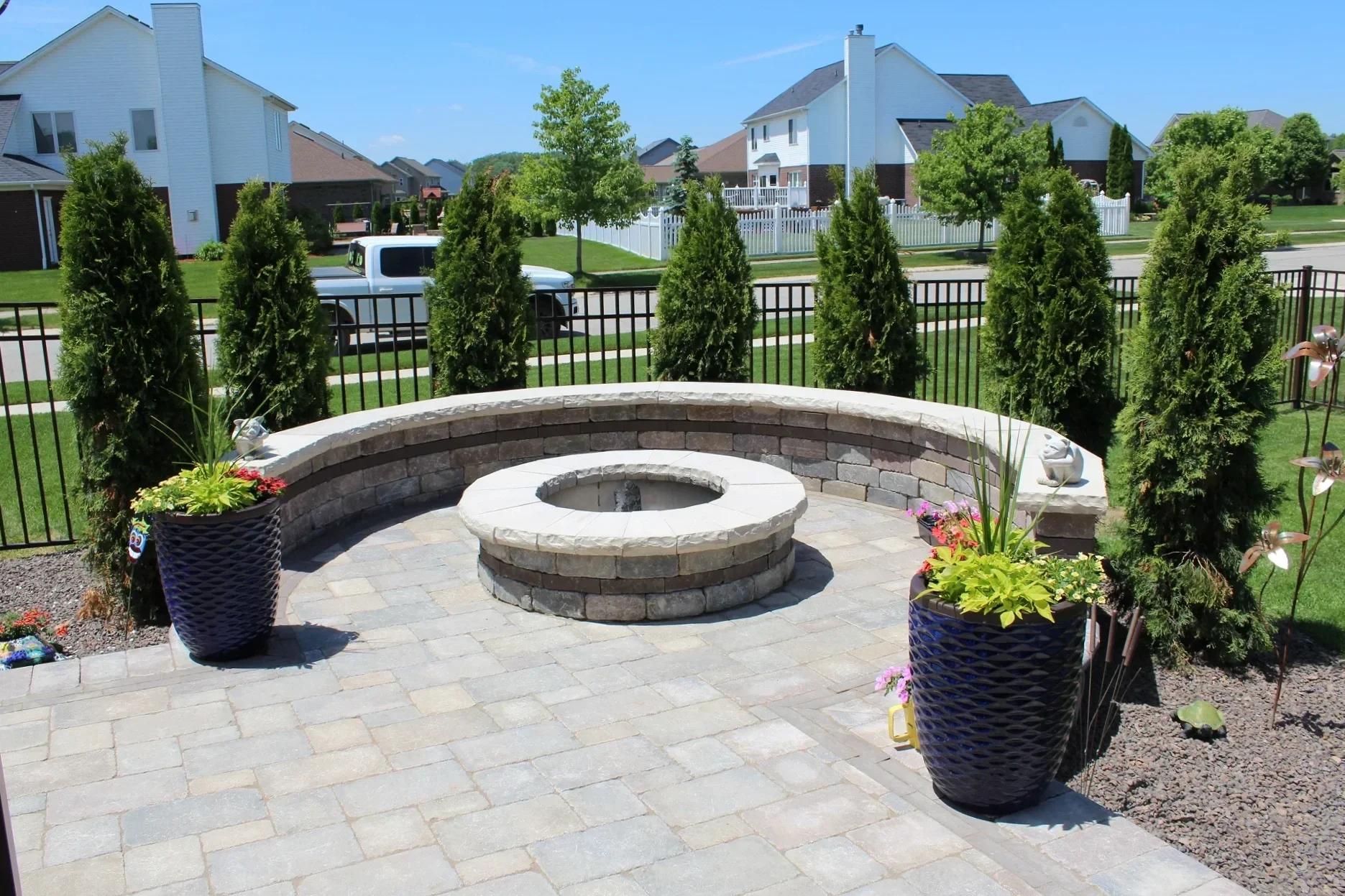 Outdoor fireplace connected to patio space in Monroe MI