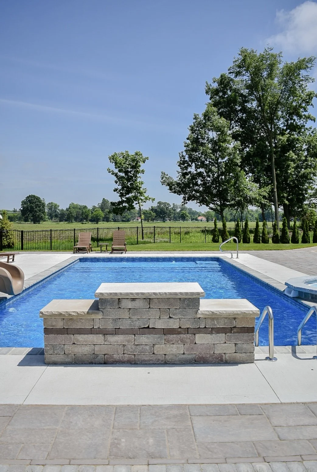 Large-format paver patio installation providing a spacious foundation for outdoor entertaining and relaxation — GLC Lawn & Landscape